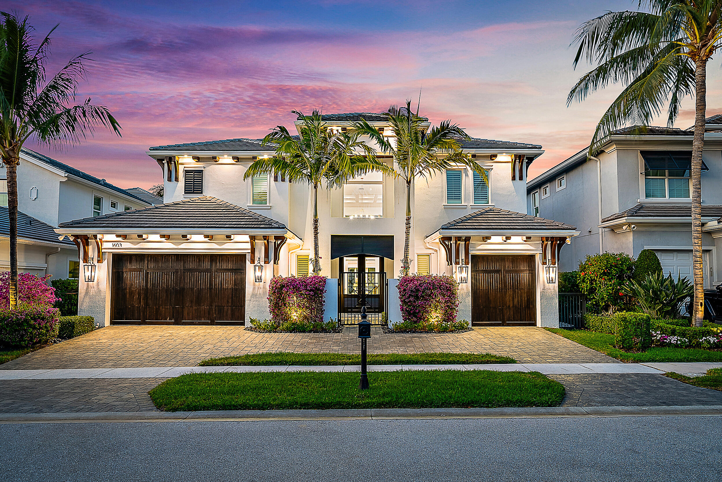 This redesigned luxury residence offers over 4,700 SF under air, blending timeless architecture with refined modern enhancements. Built in 2017, this 5+ bedroom home sits on a serene lot backing to the Juno Preserve, just one mile from the beach and premier dining. The home features custom millwork and shiplap accents throughout, seamlessly paired with high-end finishes. Highlights include a chef's kitchen with Cristallo countertops and Wolf appliances, 2 laundry rooms, whole-house generator, 3 car garage, and custom closets. The kitchen has a seamless connection to the main living spaces and oversized dining room. Outdoor living is exceptional with a redone saltwater pool and fire bowls, phantom screens, designer landscaping with turf, an outdoor kitchen, ice maker, and outdoor shower.