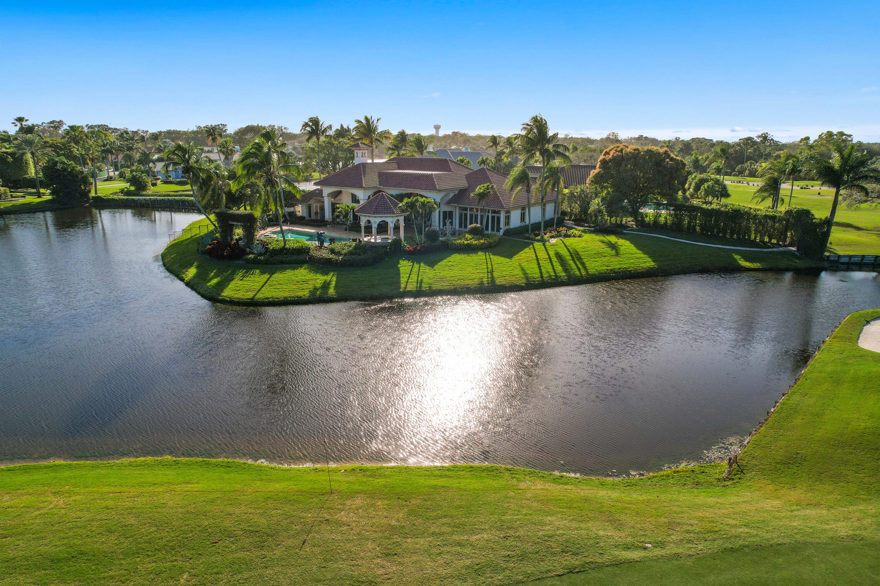 Undeniably the absolute BEST single lot in Frenchmans Creek with over 480 ft. of lake frontage!  Marvel over the spectacular wrap around lake with extraordinary expansive fairway views. This uniquely designed architectural genius allows for every room to take in these glorious views. Private golf cart path escapes to the famed south course.  Well designed plan offers 4 bedrooms, 4 full and 1 half baths, 5,351 living square feet featuring; French doors throughout, an open kitchen, a primary grande suite, library with continued wonderful views plus a separate den downstairs. Showcase beautiful landscaping designed around art, tranquil fountains and captivating natural beauty.