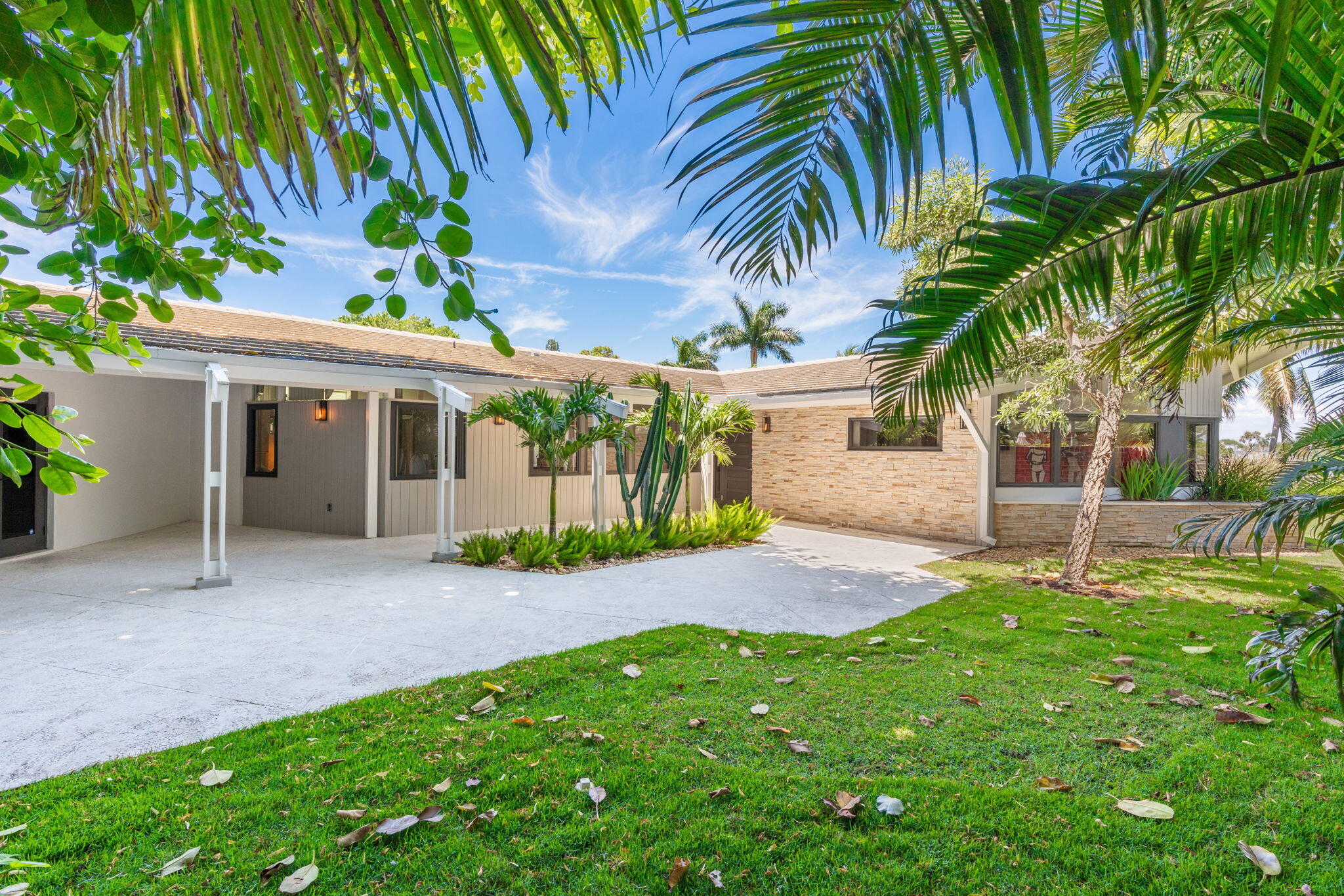 Situated Along the Middle River in the Highly Desirable Coral Ridge Neighborhood, this Exceptional Mid-Century Modern Residence is a True Architectural Gem. Originally Designed in 1960 by Acclaimed Architects Dan Duckham and Chester Trowbridge, the Home Underwent a Meticulous, Down-To-The-Studs Restoration in 2018, Thoughtfully Preserving its Design Heritage While Incorporating Modern Comforts. Inspired by the Principles of Frank Lloyd Wright, the Single-Story Residence Showcases an Iconic Asymmetrical Roofline, Expansive Walls of Glass, and a Seamless Integration of Indoor and Outdoor Living. Natural Light Fills Every Space, Highlighting the Home's Distinctive Architectural Details and Carefully Curated Finishes. Located on the Expansive Middle River, Water, Water, Everywhere, with Full Views Up and Down the River Plus a 700' Water View Straight Across the Opposing Canal. The Best of Outdoor Living with An Oversized Pool Perfectly Placed on the Near 20,000sf Lot. A Very Rare Find...