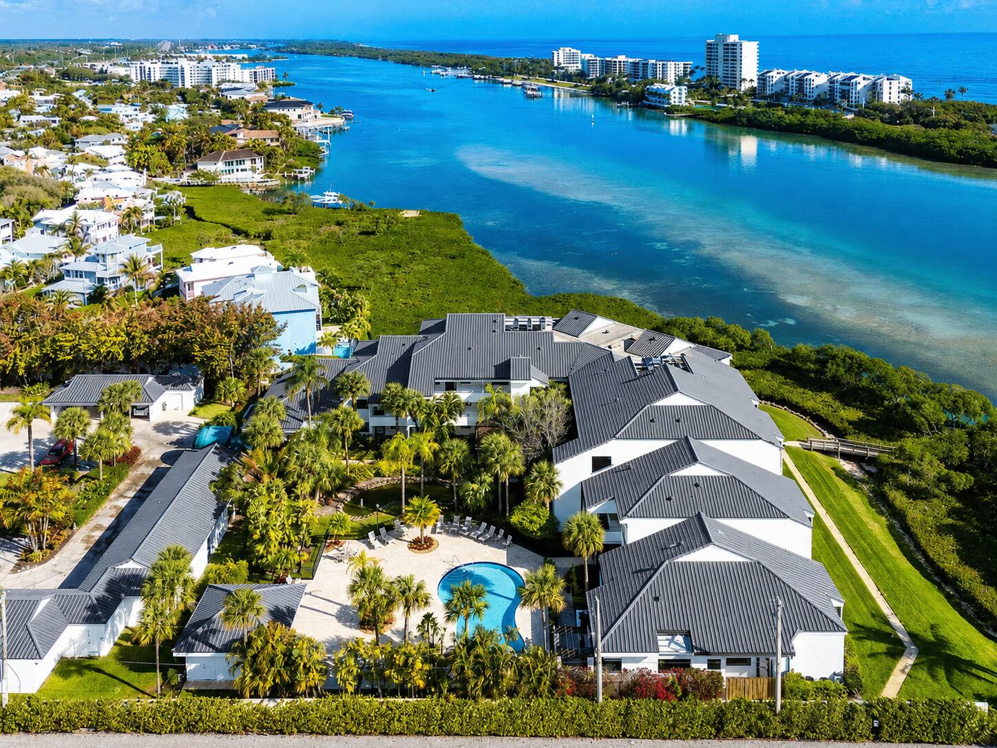 Beautifully done first floor unit in an amazing building with a brand new roof! This two bed two bath unit overlooking the intracoastal is the epitome of living the Florida lifestyle. Kitchen has been updated and opened up. Impact windows and doors, East/West exposure, Screened in patio. Unbelievable location, close to shopping, dining and the beach. Boutique style community with only 24 units. One covered parking spot with plenty of guest spots available. Do not let this one pass you by.