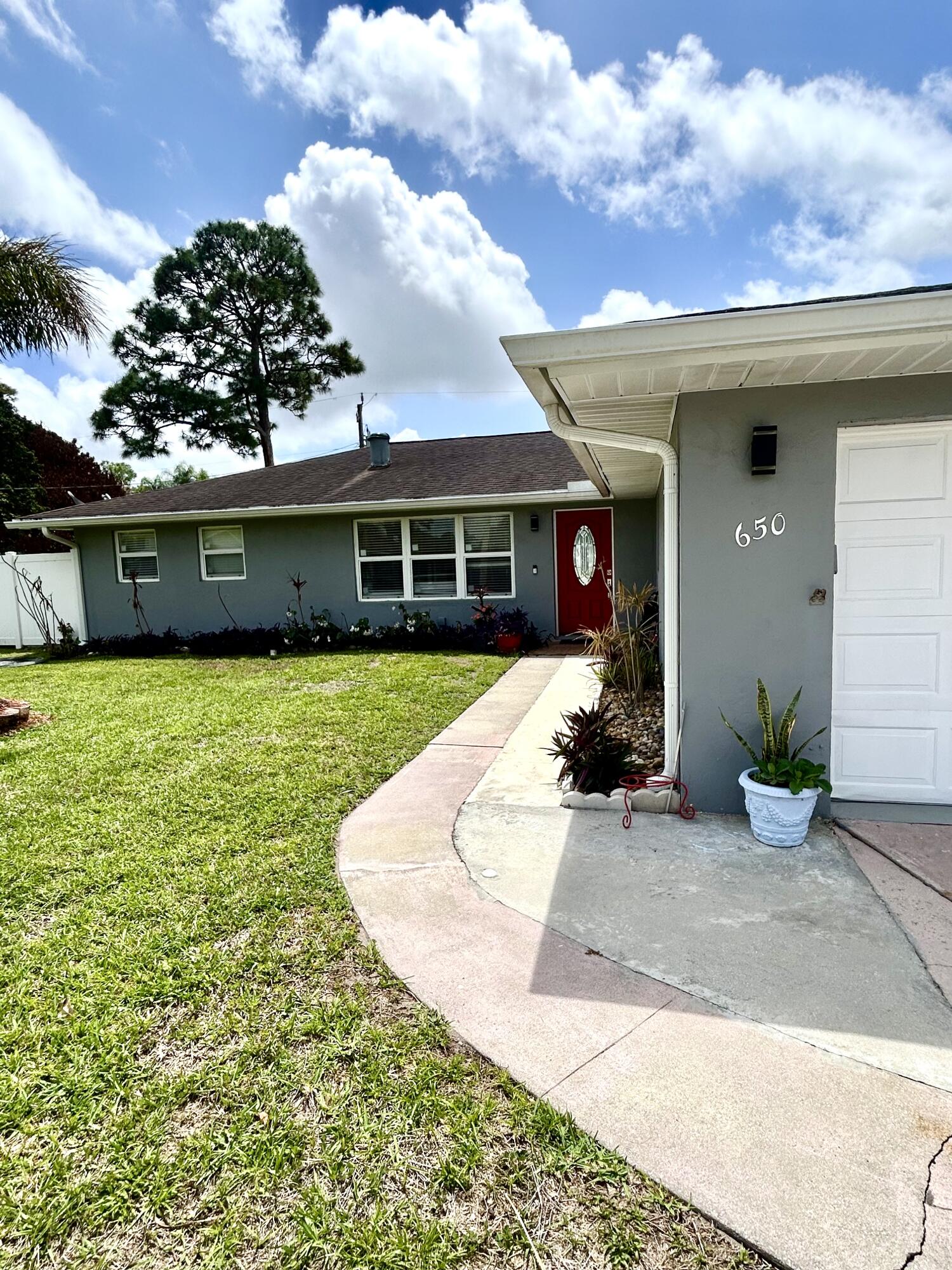 Charming 3-bedroom, 2-bath home featuring a spacious primary suite and an open-concept living area ideal for entertaining. Bright kitchen flows into the dining and living rooms, creating a welcoming, airy layout. Houses upgraded with roof installed 2020, hurricane impact windows, and beautiful porcelain tiles. Sits on a generously sized lot with room for outdoor living and gardening. Conveniently located close to shopping centers and grocery stores for easy errands and everyday living. Well-maintained and ready to move in.