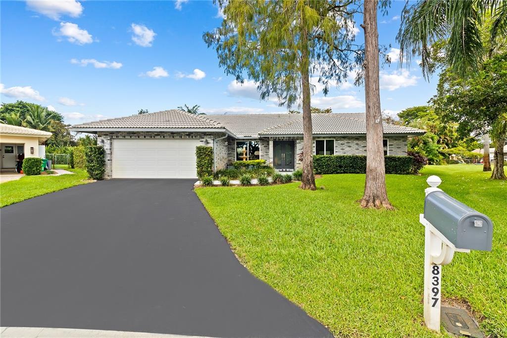 Highly desirable Ramblewood area pool home, 2cg -remodeled  with a  tropical/resort style  and a very private  13, 631 sq ft manicured pie lot with 168 ft  wide back yard full of greenery! Tiki hut and extended patio deck surround the oversized heated 30x15 pool which was remarcited in 2022. Updated designer kitchen and baths include stainless steel high-end  appliances. New central ac 2017. Double pane argon filled hurricane windows with extra UV protection on the west and south sides. Custom base and crown molding throughout. Reverse osmosis filtration in the kitchen. 50 Amp car charging station in the garage. 6.5 kilowatt hurricane generator. Rust free sprinkler system. New tankless water heater 2021. Long time owners selling their private oasis. Very well maintained-move in condition!