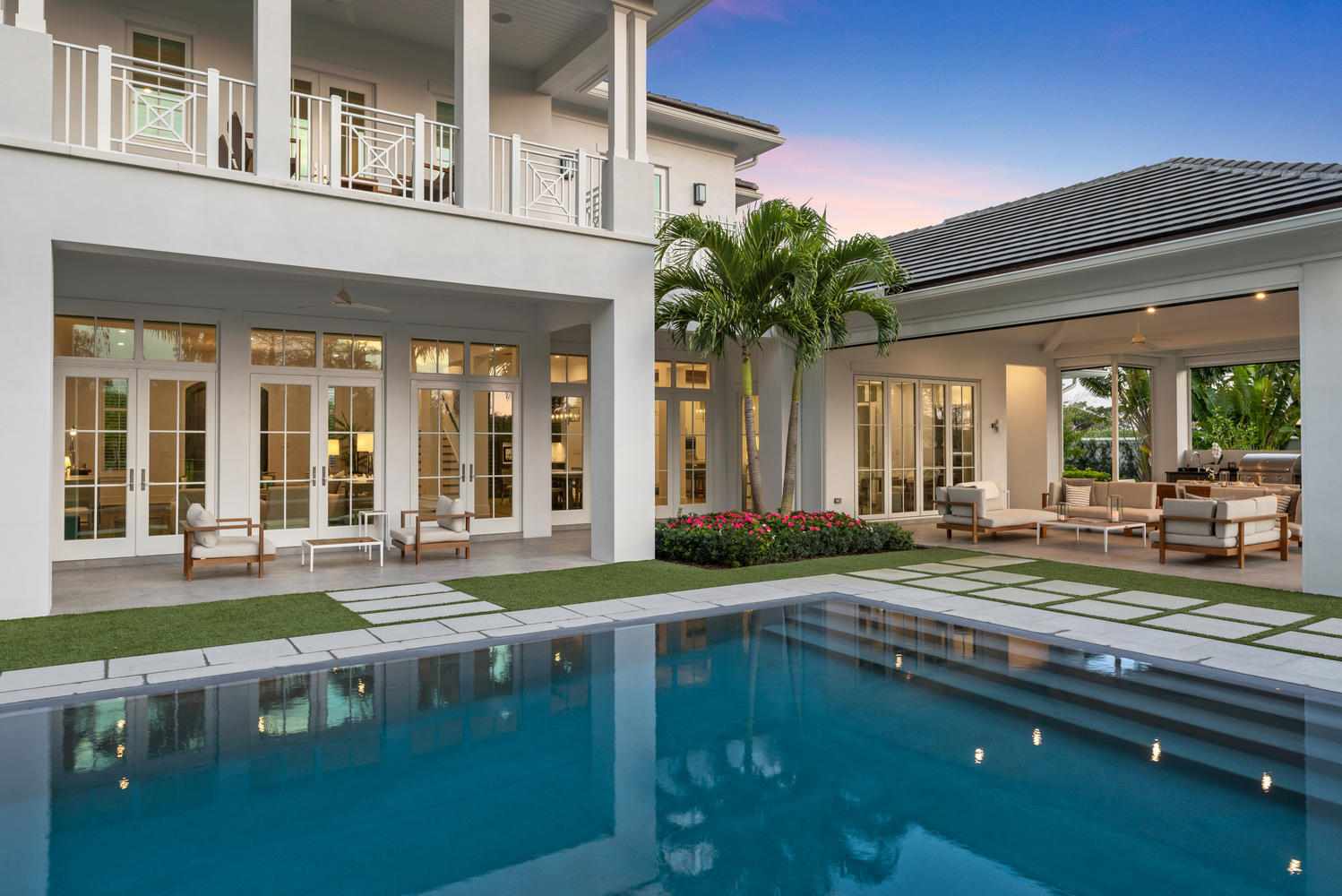 UNDERSTATED ELEGANCE Classic Estate Home located in the exclusive Blue Cypress section of the Palm Beach Polo Club.  This estate home boasts 5 bedrooms and 5.2 baths on an extended lot and is being offered fully furnished. The floor plan itself is fantastic.  The great room truly needs to be seen to be fully appreciated.  European white oak wood floors are found throughout this home which creates a natural warmth,  Vintage reclaimed beams, soaring ceilings, and bi fold doors  to the outdoor living create an unmatched indoor/outdoor living.  The master bedroom is located on the first floor with beautiful views of the pool and golf course. 2nd floor has 3 en suite bedrooms with a wonderful balcony to catch the sunsets.  You will also find a beautiful loft with a morning kitchen as well.