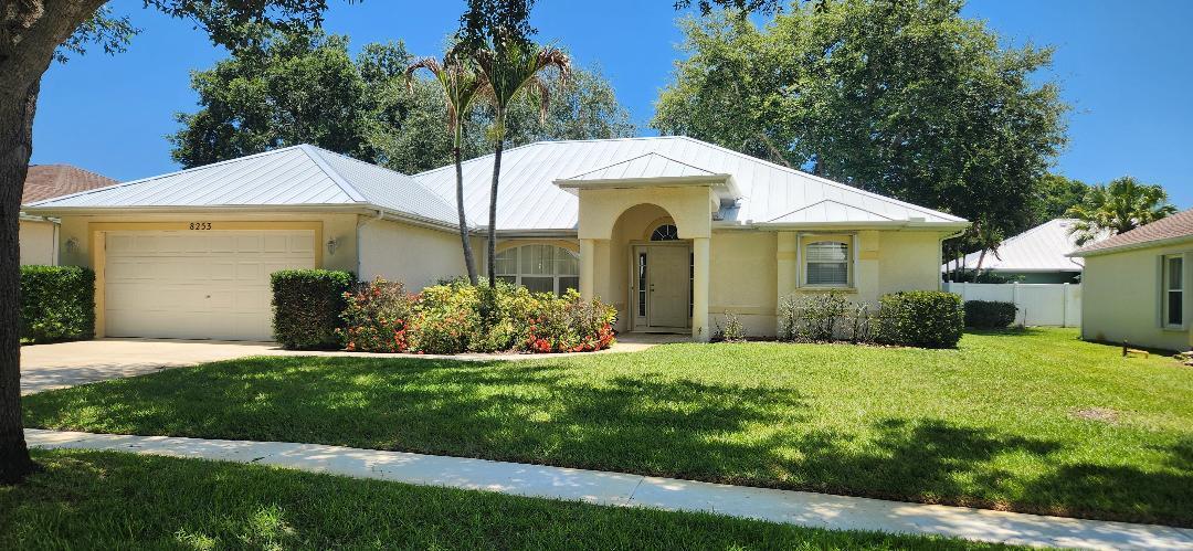 Welcome to your beautifully maintained Florida oasis! Nestled in a highly desirable and quiet Port St. Lucie neighborhood, this spacious 3-bedroom, 2-bathroom single-family home boasts 1,912 square feet of comfortable living space designed with an open-concept flow.  The standout feature of this property is complete peace of mind: it comes equipped with a brand-new, professional-grade metal roof installed in 2025, offering maximum durability, energy efficiency, and insurance savings for decades to come. Coupled with sturdy accordion storm shutters, this home provides premium, hassle-free hurricane protection so you can enjoy the Florida lifestyle completely stress-free.  Inside, you will find a bright and airy floor plan featuring clean tile and cozy carpet flooring, a spacious master suit Easy to show! Capitalize on incredible buyer appeal with this meticulously maintained 3BR/2BA, 1,912 sq. ft. home featuring huge capital improvements. Features a brand-new premium metal roof (2025) and full accordion shutters throughout—major selling points for insurance savings and wind-mitigation credits! Very low HOA fee makes this an incredibly easy sell. Please use ShowingTime to schedule. Offers must be submitted on standard FAR/BAR As-Is contract with a pre-approval letter or proof of funds. Title has been pre-opened for a smooth transaction.