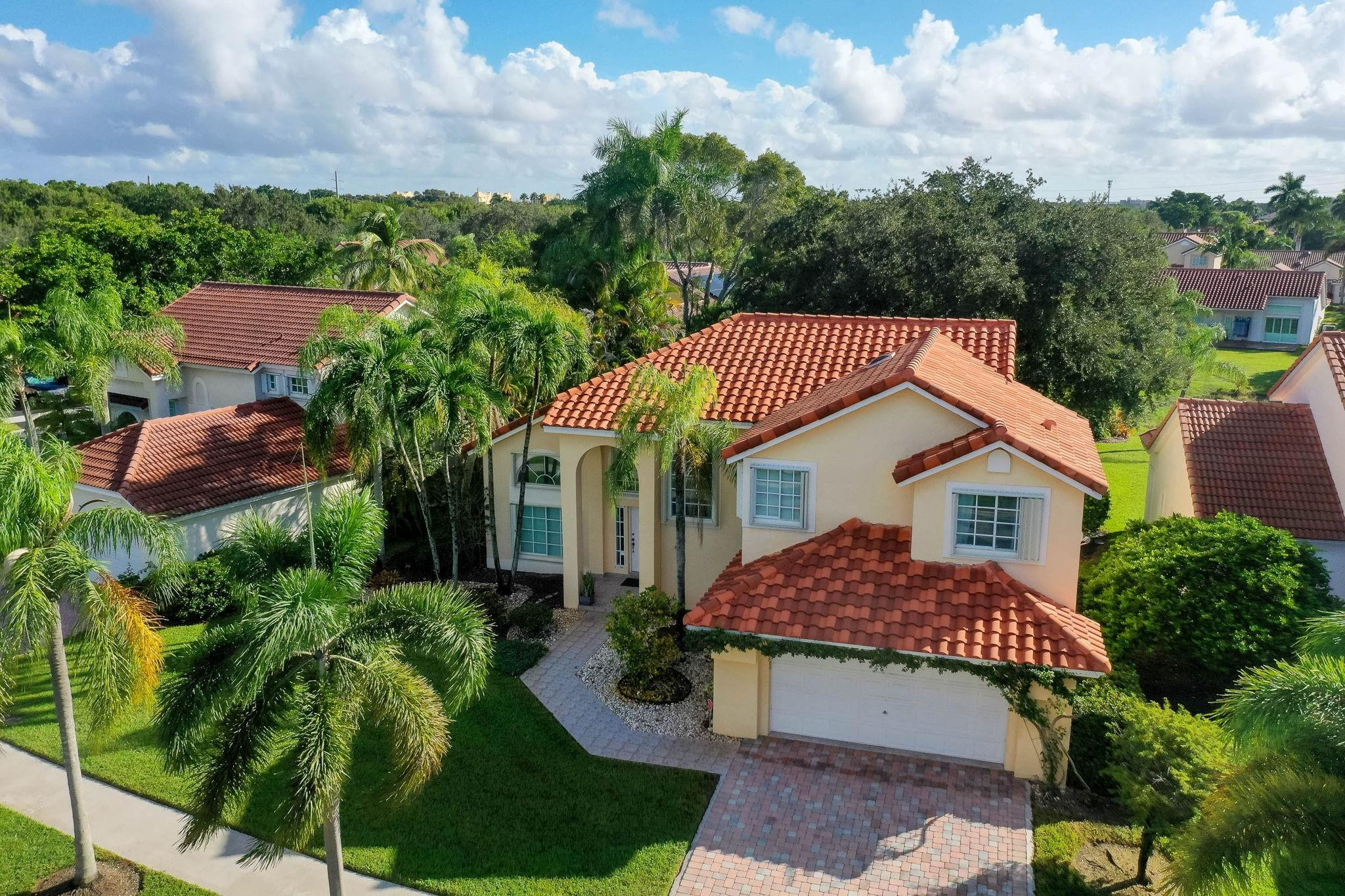 Welcome to your dream home in Laguna Springs II. This is your chance to secure an exceptional property in one of Weston's most desirable communities. Step into this beautifully remodeled residence, located in a gated, close-knit neighborhood of fewer than 100 homes, offering both privacy and a true sense of community. Inside, you'll find a fully updated interior featuring a modern kitchen with newer appliances and elegantly renovated bathrooms that perfectly balance style and functionality. The home also includes a versatile additional room, ideal for a home office, den, library, or even a potential extra bedroom, adapting seamlessly to your lifestyle needs. !Step outside to your own private oasis. The backyard is perfect for relaxing, entertaining, or simply enjoying Weston’s serene atmosphere.  All of this is within walking distance (less than a mile) to places of worship, parks, top-rated schools, and shopping centers offering the perfect balance of comfort, convenience, and community.