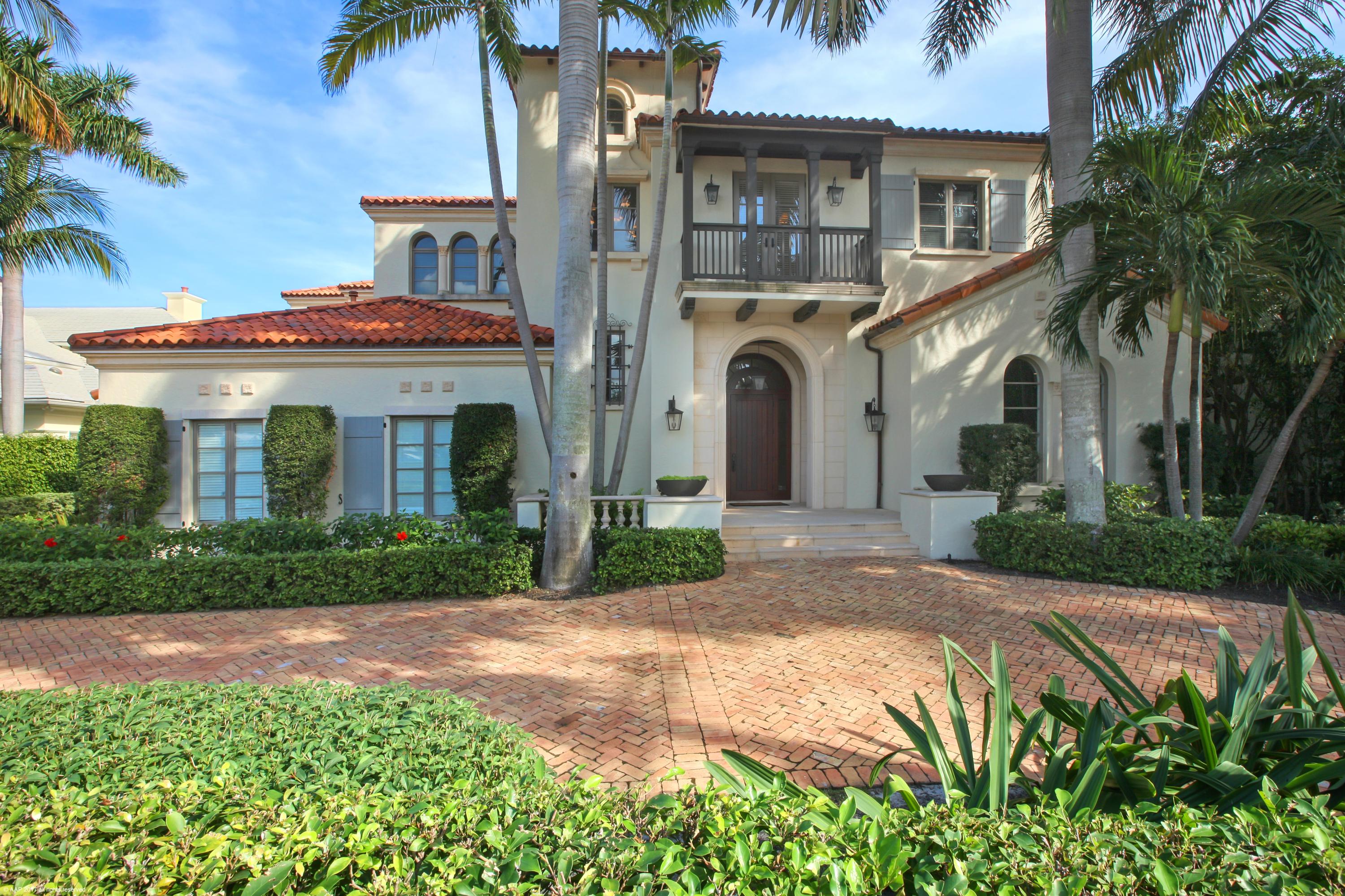 Enjoy expansive intracoastal views from this estate home perfectly situated on an over-sized lot. The custom interior features four separate guest suites Classically styled interiors include a gracious foyer, a stunning waterfront living room, dining room, and a generous club room offering a full-service bar and wine cellar.  Adjacent is a game room/library.   The chef’s kitchen opens to a light-filled family room and breakfast room.  All open through French doors to the loggia with cypress ceilings, a summer kitchen and fireplace providing outdoor living spaces and capitalizing on the gorgeous views. A private in-law suite is located off the loggia. Two blocks from shops, galleries and restaurants of Atlantic Avenue, yet all the privacy of a secluded estate.  See exclusions.