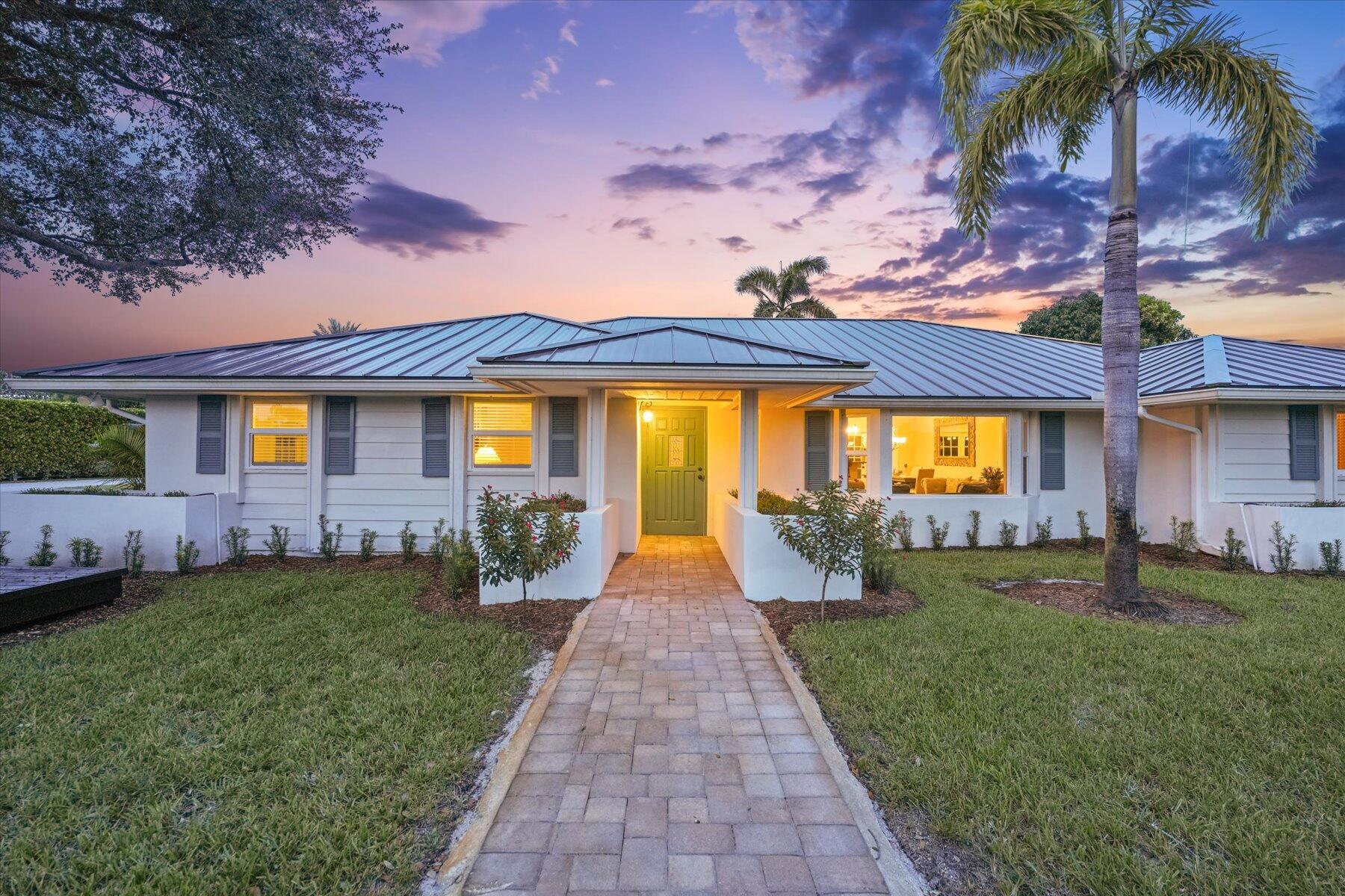 This exceptional equestrian facility, nestled in the heart of Saddle Trail, is just a 5-minute hack from the Palm Beach International Equestrian Center. The property features a luxurious four-bedroom main house with an additional efficiency apartment, complete with its own entrance. The master bedroom opens to a heated pool and jacuzzi, enhancing the living experience. The barn is equipped with ten stalls, dedicated tack and feed rooms, and a comfortable owner's lounge. It also includes five spacious wash/grooming stalls and a separate barn laundry. Additional amenities include two oversized garage areas and two one-bedroom staff apartments above the garages. The highlight is the world-class, 100 X 175, self-irrigated sand arena, ensuring uninterrupted training.