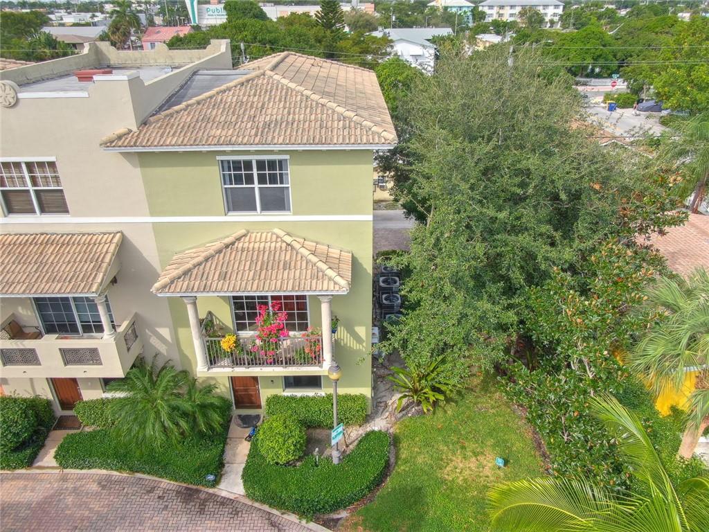 Beautiful 3 story Mediterranean style townhome in Lake Worth. This home has wide windows for natural light. All white walls inside the house create an atmosphere full of peace. First floor - one bedroom with bath, and 2 walk-in closets. Second Floor - open concept plan that includes kitchen with stainless steel appliances and granite countertops, living room, dining room, half bath, laundry room, and balcony. Third floor -two more bedrooms with full baths each (Master bath has double vanity with granite top), walk-in closet and balcony. Two car garage. Minutes away to enjoy downtown Lake Worth nightlife. Within walking distance of the beach, restaurants, and stores. 5 minutes to West Palm Beach and 1 hour to Miami. Owner is motivated to sale.