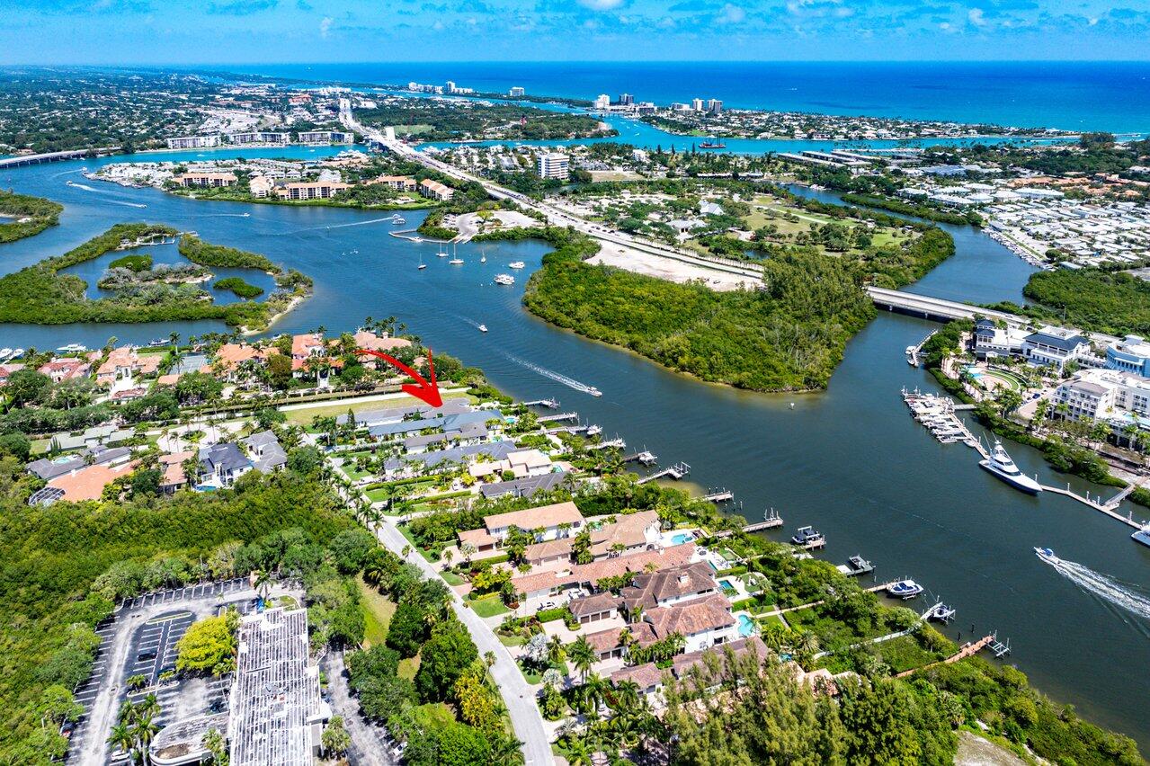 DIRECT INTRACOASTAL-BEST LOCATION IN JUPITER- this is a one of a kind fully renovated luxury estate featuring a 3 bedroom 3.5 bathroom main house with a 1 bedroom, 1 bath guesthouse all with the convenience of ground floor living!  In addition this home has been upgraded with a 3 car air conditioned garage and Versa Lift System for storage convenience. From the beautifully manicured front entrance to a backyard perfectly suited to intracoastal entertaining, no expense has been spared in creating the ideal tropical oasis.  The luxury upgrades of this exquisite home need to be seen to be appreciated including a fully renovated kitchen with top of the line appliances, new metal roof, new AC system, new driveway, premium landscape lighting, whole house generator, new tankless water heater, Tonal Exercise Gym, new pool pumps and a backyard that simply has it all.  The backyard's eastern exposure & proximity to the beach enable you to enjoy afternoon coastal breezes in a private backyard oasis with a heated pool/hot tub, alfresco gourmet summer kitchen, artificial turf putting green and covered patio with motorized bug screen where you can enjoy the game while watching an endless parade of boats gently idling by. The ''no wake'' location sits on Jupiter's prime paddleboarding & kayaking waters which also allows you to keep your boat up on a lift or dock a larger boat in the water. Located in a small, gated community in the heart of Jupiter this home offers walkability to restaurants, shopping, theaters, and only a mile from the beach! 
Hide
