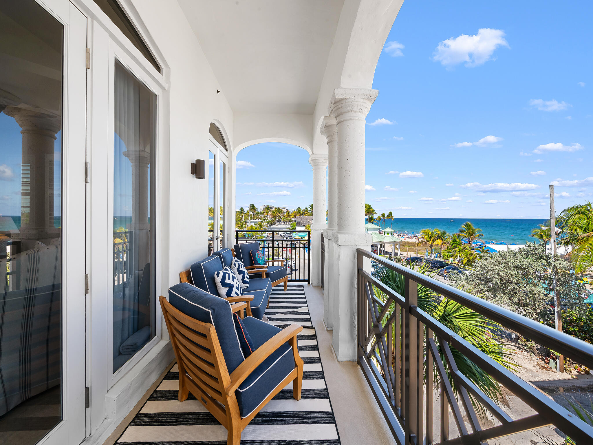 Enjoy the ultimate coastal lifestyle in this rarely available 3-bedroom, 2½-bath end unit offering 2397 sq. ft. of beautifully designed living space just steps from the sparkling Atlantic. Secure elevator access opens directly into your private foyer, welcoming you into a home defined by thoughtful details. Travertine marble floors flow throughout  complement the open layout. The gourmet kitchen features a large cooking island, premium appliances, perfect for casual dining or entertaining. The primary suite offers a serene retreat with a spa-inspired bath. Two assigned covered parking spaces, plus dedicated bike and beach storage, provide ultimate convenience. Enjoy private beach access and a prime location close to shopping, dining, and all the charm of Lauderdale by the Sea.
