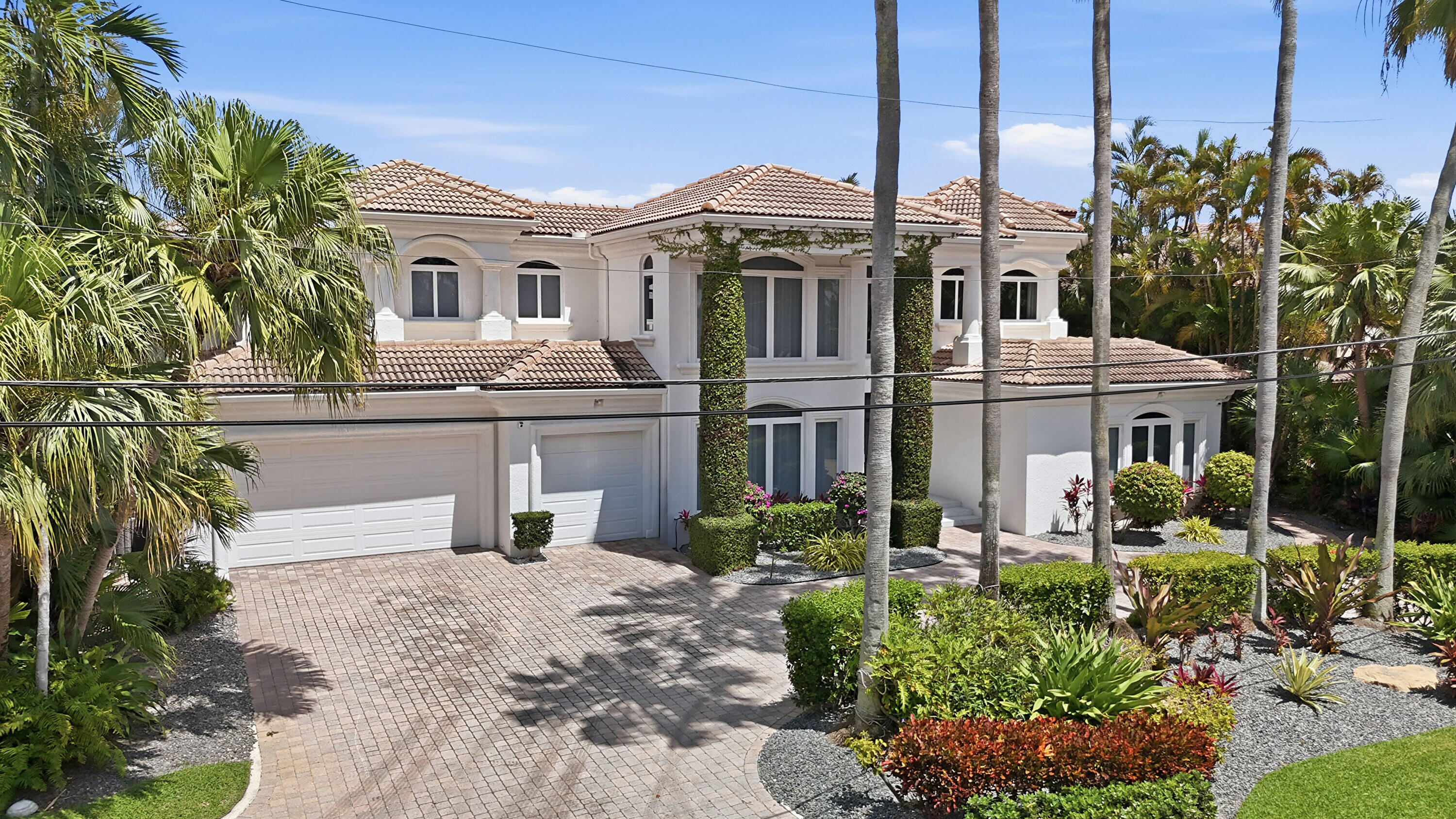 Experience waterfront luxury at this spectacular turn-key Direct Intracoastal estate in Boca Raton. Located on a quiet cul-de-sac, this beautifully updated, modern home spans over 7,100 total square feet, creating the ultimate boater's paradise with 100 feet of waterfront and a private dock. The thoughtful floor plan features 4 bedrooms and 4.5 baths, including a massive second-floor master suite. Two bedrooms and two baths rest on the first floor, offering ultimate guest privacy. Enjoy seamless movement across floors with your private elevator. Meticulously maintained, the home boasts 4 newer A/C units and arrives partially furnished for an easy move-in. Live just minutes from the vibrant downtown dining and shopping of both Delray Beach and Boca Raton. Don't miss this rare opportunity. All newer 4 A/C units