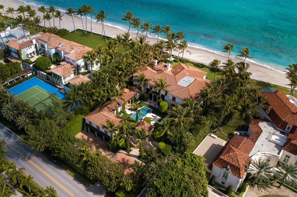 Stunning direct oceanfront estate exceptionally designed by Thomas Kirchhoff with interiors by David Kleinberg. An impressive home with grand scale, excellent floor plan, 7 bedrooms, 7 baths, and 5 powder rooms, two oceanfront loggias, courtyard pool and cabana, exercise room, temperature- controlled wine cellar, elevators, generator, and 3 car air-conditioned garage. Beautiful formal dining room perfect for entertaining with views of the ocean and courtyard. Built in 2007 with rich finishes, beautiful marble and hardwood floors, stunning limed cypress coffered ceiling details, and intricate millwork throughout. Sweeping ocean and beach views.