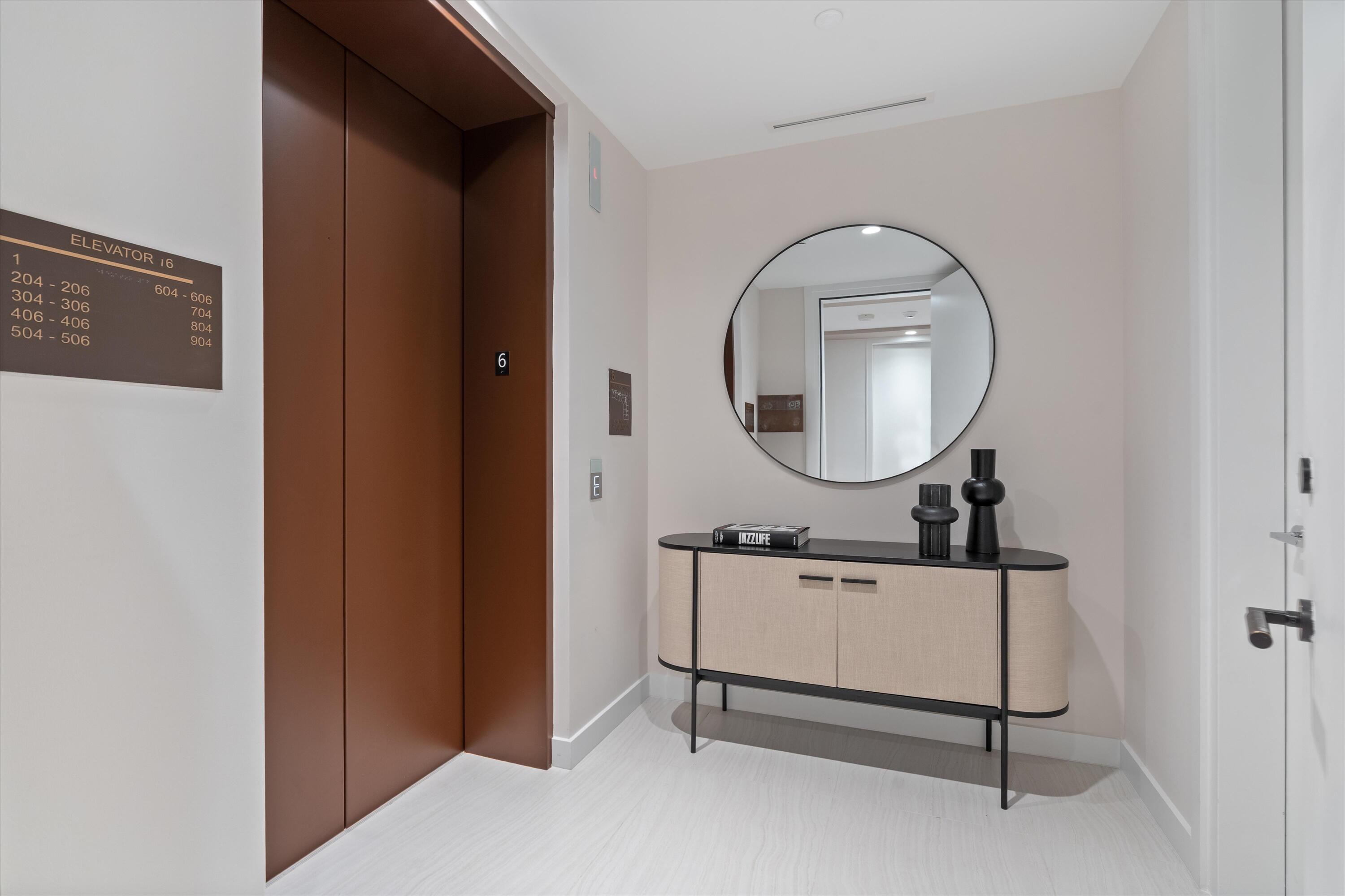 This impeccably furnished, completely turnkey residence is ready for immediate move-in. Located in the prestigious ALINA Residences in the heart of downtown Boca Raton, this brand-new 6th-floor condo redefines luxury living. The thoughtfully designed layout includes two spacious bedrooms, a flexible den, and two-and-a-half elegant bathrooms. Enjoy private elevator access that opens to a light-filled, open-concept living space with soaring floor-to-ceiling windows showcasing sweeping city views. The terrace invites golden-hour sunsets and outdoor dining, while inside, no detail has been overlooked—from custom closets and electric shades throughout to exquisite Italian finishes. The state-of-the-art Gaggenau kitchen features an induction cooktop, wine fridge, and an oversized walk-in pantry.