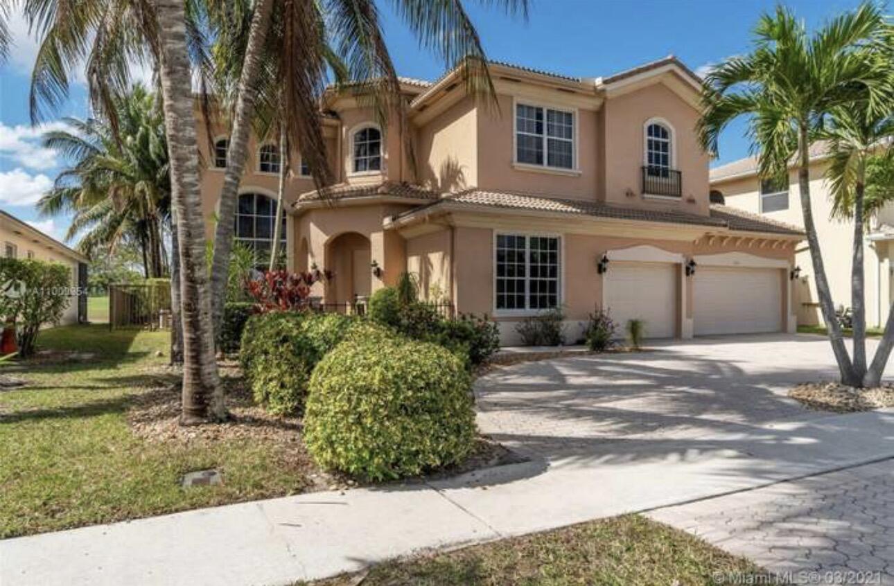 Experience luxury lakefront living in this stunning Mediterranean-style estate located in the highly desirable gated community of Madison Green in Royal Palm Beach. Situated on a premium golf course lot, this spacious residence offers over 4,200 square feet of beautifully designed living space with 5 bedrooms, 4 bathrooms, soaring ceilings, and an abundance of natural light throughout. The elegant floor plan features expansive living areas, formal dining space, and a large gourmet kitchen perfect for entertaining and everyday living. Step outside to your private tropical oasis featuring a resort-style pool, spacious patio area, and breathtaking lake and golf course views. A circular driveway and 3-car garage add impressive curb appeal and convenience.