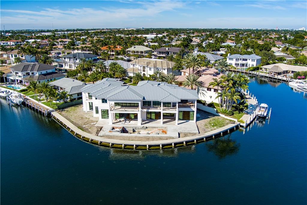 The Crown Jewel of Lighthouse Point. A New Coastal-Inspired Trophy Point Estate sited on 240'± of deepwater on the confluence of the Kingfisher Waterway and the Cap Knight Bayou with spellbinding panoramic water views. Two-story residence with 6 bedrooms,7 full baths and 1 half bath. Fresh Island-inspired interiors with a Hampton's flair. Impressive primary wing with spa-like bath, dual boutique closets & wraparound covered balcony. Other amenities include elevator, 4 bay garage, club room with wine display & more. Outdoor entertaining is enjoyed at the expansive lanai with summer kitchen and resort-style pool with sun shelf and spill over spa. Yacht dockage for the avid yachtsman minutes to the Hillsboro Inlet. Shown By Appointment Only to pre-qualified buyers. Completion for Summer 2022. DISCLAIMER: Information published or otherwise provided by the listing companyand its representatives including but not limited to prices, measurements, squarefootages, lot sizes, calculations, statistics, and videos are deemed reliable but arenot guaranteed and are subject to errors, omissions or changes without notice.All such information should be independently verified by any prospectivepurchaser or seller. Parties should perform their own due diligence to verify suchinformation prior to a sale or listing. Listing company expressly disclaims anywarranty or representation regarding such information. Prices published areeither list price, sold price, and/or last asking price. The listing companyparticipates in the Multiple Listing Service and IDX. The properties published aslisted and sold are not necessarily exclusive to listing company and may be listedor have sold with other members of the Multiple Listing Service. Transactionswhere listing company represented both buyers and sellers are calculated as twosales. The listing company’s marketplace is all of the following: Vero Beach, Townof Orchid, Indian River Shores, Town of Palm Beach, West Palm Beach, ManalapanBeach, Point Manalapan, Hypoluxo Island, Ocean Ridge, Gulf Stream, DelrayBeach, Highland Beach, Boca Raton, East Deerfield Beach, Hillsboro Beach,Hillsboro Shores, East Pompano Beach, Lighthouse Point, Sea Ranch Lakes andFort Lauderdale. Cooperating brokers are advised that in the event of a Buyerdefault, no commission will be paid to a cooperating Broker on the Depositsretained by the Seller. No commissions are paid to any cooperating broker untiltitle passes or upon actual commencement of a lease. Some affiliations may notbe applicable to certain geographic areas. If your property is currently listed withanother broker, please disregard any solicitation for services. Copyright 2021 bythe listing company. All Rights Reserved.