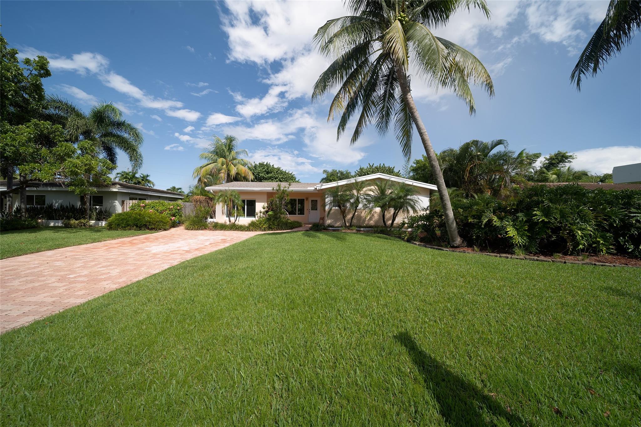 One of the largest homes in Floranada Ridge. Nicely maintained 2600+ SF 4 Bed 3 Bath pool home in the center of the block on 17 Ave. New roof, impact windows, heated 450 SF pool, paver driveway means that you can focus on what you want to do to personalize it especially if you don't want the white walls, gray tile and white kitchen that most updated homes have. Located close to what  Florida residents love and need. Beach is 2 miles away, healthcare, schools, shopping and restaurants are close. Enjoy the benefits of living on the east side of Broward County. Activities for everyone can be found at Downtown Fort Lauderdale, Las Olas, Oakland Park and the Wilton Manors entertainment areas. Come see this property!