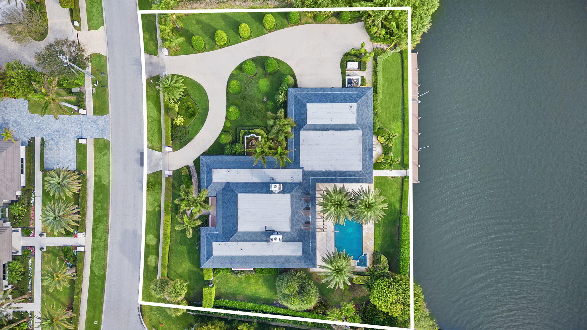 1500 Lands End presents an extraordinary opportunity to acquire one of the most expansive and exclusive parcels in Point Manalapan. This breathtaking Seaside Estate, meticulously designed by a renowned televised designer known for her projects in South Hamptons and Beverly Hills, is situated on nearly 30,000 square feet of prime land(Developer's dream double lot corner lot with capability to subdivide!) boasting over 200 feet of picturesque water-frontage, complete with an 80-foot dock. Spanning nearly 4,400 square feet of meticulously designed living space, this residence exudes coastal elegance with its French Bermuda style architecture and lush, mature landscaping. Revel in the tranquility of serene water views while lounging by the private pool, and indulge in outdoor culinary delights with the convenience of a built-in Summer Kitchen. The property further boasts a spacious 3-car garage, an oversized circular driveway, a whole house generator, and the peace of mind provided by high-impact hurricane windows and doors throughout. Welcome to your idyllic retreat, where every detail embodies the essence of coastal island living.