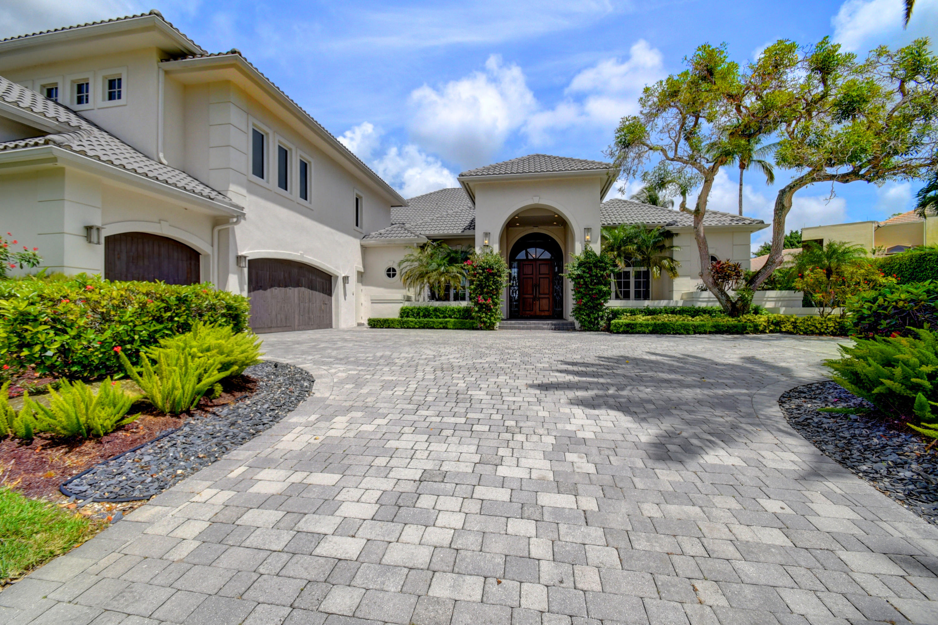 Woodfield Manor features a sprawling waterfront estate pristinely situated on nearly one acre in the exclusive enclave of Princeton Estates – the crown jewel of Woodfield Country Club. This awe-inspiring 11,000 square foot residence recently underwent a complete renovation and boasts seven bedrooms, nine and a half baths, a professional grade kitchen, two full wet bars, a theatre , game room, office, den, six-car garage with dedicated golf cart entry and a state-of-the-art smart home automation system. 

The home features a breathtaking ground floor master suite with a dramatic fireplace, sitting room and incredible views of the lake. The piece de resistance is the set of jaw-dropping his-and-her bathrooms with immaculate and well thought out built-ins, complete with safes and islands. The home has two separate wings including a private family wing and a separate entertainment wing with a game room and movie theatre with stadium seating.  

Outside, a newly installed grand pool awaits, along with a spa, waterfall and fountain. The highly sought-after southeastern exposure lights up the rare and beautiful combination of both lake and golf views. In addition, there is also an expansive home garden and sport court, both waiting to be lovingly utilized by a new family. 

Upgrades include: Whole house generator.

Custom link to property: www.5258nw37thave.com