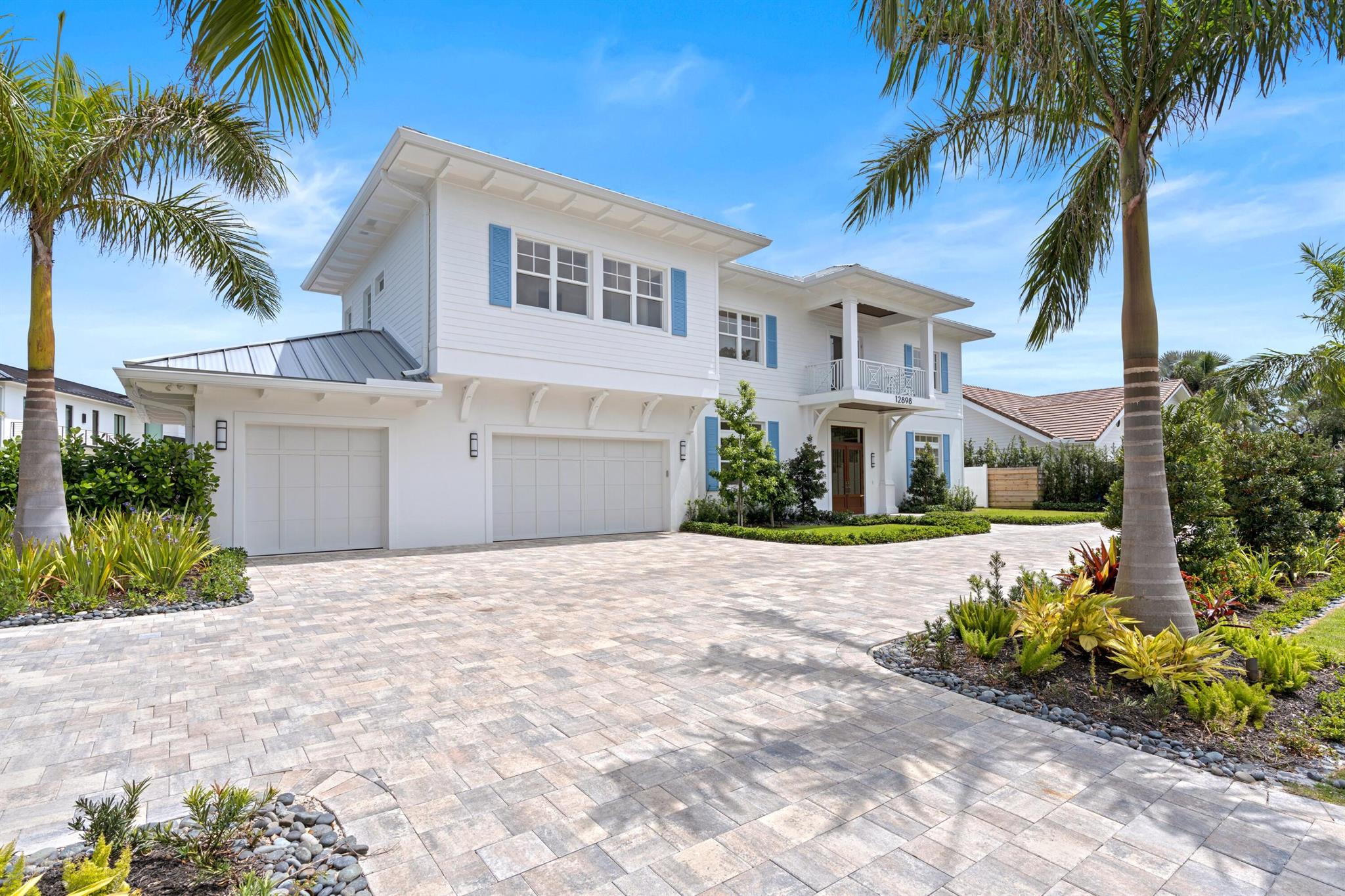 Prime Location! Prime Views! Prime Luxury! This newly constructed waterfront haven boasts 240 feet of water frontage on .61 acres of prime real estate in Palm Beach Gardens. Revel in the breathtaking vistas of the intracoastal throughout this stunning home. Crafted with a harmonious blend of transitional, coastal, and modern architectural elements, this home radiates sophistication.

Every detail has been meticulously crafted, from the impeccable construction to the high-end finishes. Boasting 5 ensuite bedrooms, a den/office, 3-car garage, and an expansive great room seamlessly connected to a chef's kitchen with an additional kitchen tucked away in the butler pantry, this home is designed for both comfort, style and entertaining. 

Step outside to the covered lanai, complete with a summer kitchen and phantom screens, extending your living space and inviting the outdoors in. Lounge by the heated and chilled pool, soaking in the panoramic intracoastal views and the gentle coastal breeze. Additionally, there's a huge yard awaiting landscape fencing for your privacy and pleasure. Boating enthusiasts will delight in the 240 feet of brand new seawall and dockage, perfectly poised for easy ocean access with no fixed bridges. Built on 48 auger pilings with the pool resting on helical piles, this home is not only luxurious but built to stand the test of time.

Don't let this opportunity slip away - seize the chance to own this waterfront gem at a remarkable value. Compare with the recent sales in the area and you'll see the incredible value: a neighboring property just sold for $7,650,000 with only 80' of water frontage, on a smaller lot and no intracoastal views. Our pricing falls beneath both market value and appraisal estimates.