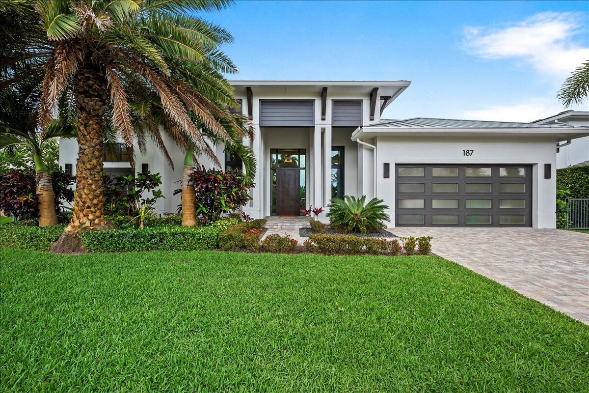 Welcome to an exceptional coastal retreat, where modern luxury meets effortless living in a beautifully crafted single-story residence built in 2020. Designed with both sophistication and comfort in mind, this stunning home offers 3 bedrooms plus an office—easily convertible into a fourth bedroom—creating a versatile layout to suit your lifestyle. Step inside to discover soaring vaulted ceilings accented by custom lighting, filling the home with natural light and an airy elegance. The heart of the home is a chef-inspired kitchen featuring premium Thermador appliances, an expansive island perfect for casual dining and entertaining, and abundant cabinetry for seamless organization. The primary suite is a true sanctuary, complete with 2 walk-in closets and a luxurious spa-like (continued) bath showcasing a freestanding soaking tub, dual vanities and shower heads, and a dedicated linen closet for added convenience. Every detail has been thoughtfully designed to elevate everyday living. Outdoor living is equally impressive, with a large, covered lanai overlooking a heated saltwater pool surrounded by lush turf and striking fan palms. An outdoor shower enhances the resort-style experience, creating the perfect setting for relaxation or entertaining year-round. A two-car garage with sleek epoxy flooring adds both style and functionality. Located in the exclusive community of Jupiter Inlet Colony—the southernmost tip of Jupiter Island—residents enjoy a rare coastal lifestyle surrounded by the Atlantic Ocean, Intracoastal Waterway, and Jupiter Inlet. This intimate enclave of just 240 homes offers its own police department, adding an extra level of privacy and security. Enjoy a short stroll to the JIB Club Marina and Cato's Bridge, where snorkeling beneath the bridge is a local hidden gem. Fine dining, boutique shopping, and Palm Beach International Airport are all within easy reach, making this a truly unparalleled place to call home.