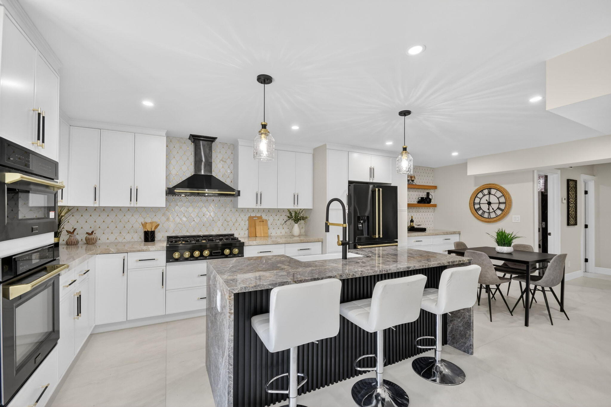 Rare Southland Park opportunity on an oversized 9,583 sq ft. fully fenced lot. This newly renovated 5BR/4.5BA home offers the charm and location buyers want near the Intracoastal and Downtown West Palm Beach, with ONE major advantage: home is not historically designated, giving future owners added flexibility to explore expansion or additions, subject to approvals. The home features impact windows and doors, updated all major systems, chef's kitchen with gas cooking, Taj Mahal quartz countertops, and a walk in wine cellar. The layout includes bedroom suites on both levels, offering first floor flexibility for guests, family, or multigenerational living, while the upstairs primary suite provides privacy. Pool, renovated, and rare lot size make this a move-in ready home with long term upside
