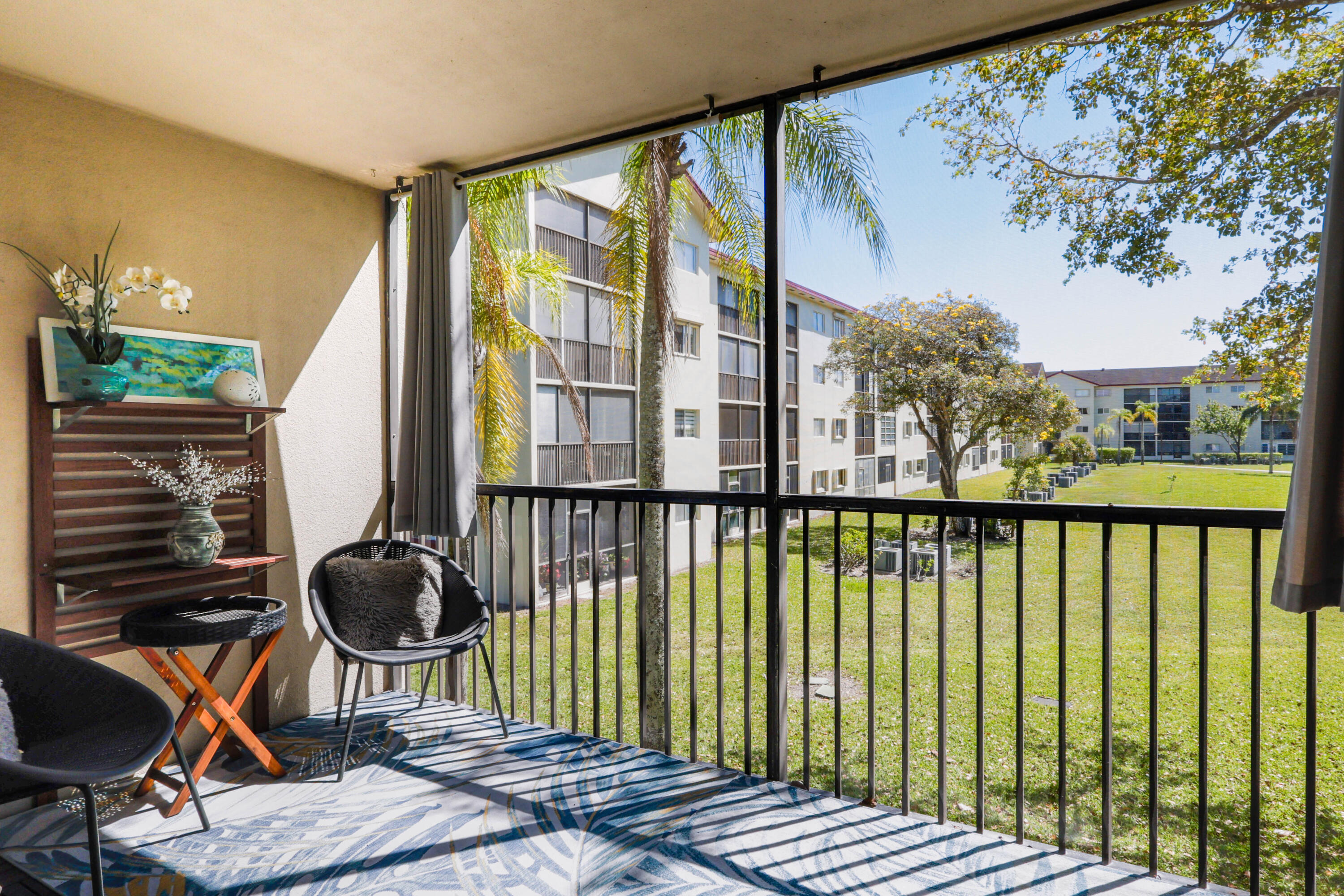 55+ Resort style living in this bright 2 bed 2 bath corner unit, the second largest split floor plan in Century Village. Features include wood flooring throughout, walk in closets, and a private balcony overlooking the pool and gardens perfect for morning coffee or evening wine. Ideally located near the Pembroke Rd entrance for added convenience. Major upgrades in the last 6 months include new A C, air handler, electrical panel, water heater, washer, dryer, and blinds. Century Village offers a clubhouse, fitness center, restaurant, golf, and transportation. HOA includes water, internet, sewer, trash, security, and landscaping. 1 parking space plus guest parking. 55+ community with approval required. Garfield (A-B-C-D) Open for new purchase applications with rental restrictions Owners must own the unit for two years before they can rent There is a 15% cap on rentals in the association Requires $500.00 refundable move-in deposit For New Purchase - refundable to new owners once they move in For New Rentals - refundable to owners once the tenant moves out Requires a $500.00 alteration deposit, refundable once the work is completed and common areas inspected.  Alterations require an application that must be approved by the association before work can begin, along with the deposit (if applicable).  Payments for Move in Deposits are payable to the association Payments for elevator pads are payable to Landmark Management Services.