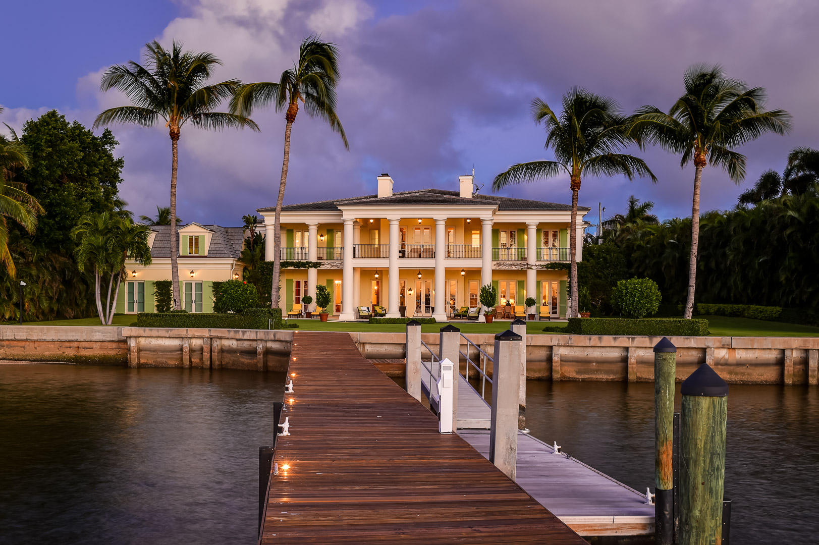 Stunning custom lakefront Plantation style estate. Property has approximately 160 feet +/- of water frontage, deep water dock, 5 bedrooms, 7 full baths, 3 half baths, gym, and 4 car garage. Spectacular oversized lakefront loggia and balcony. Smart home with the highest quality finishes and technological amenities.