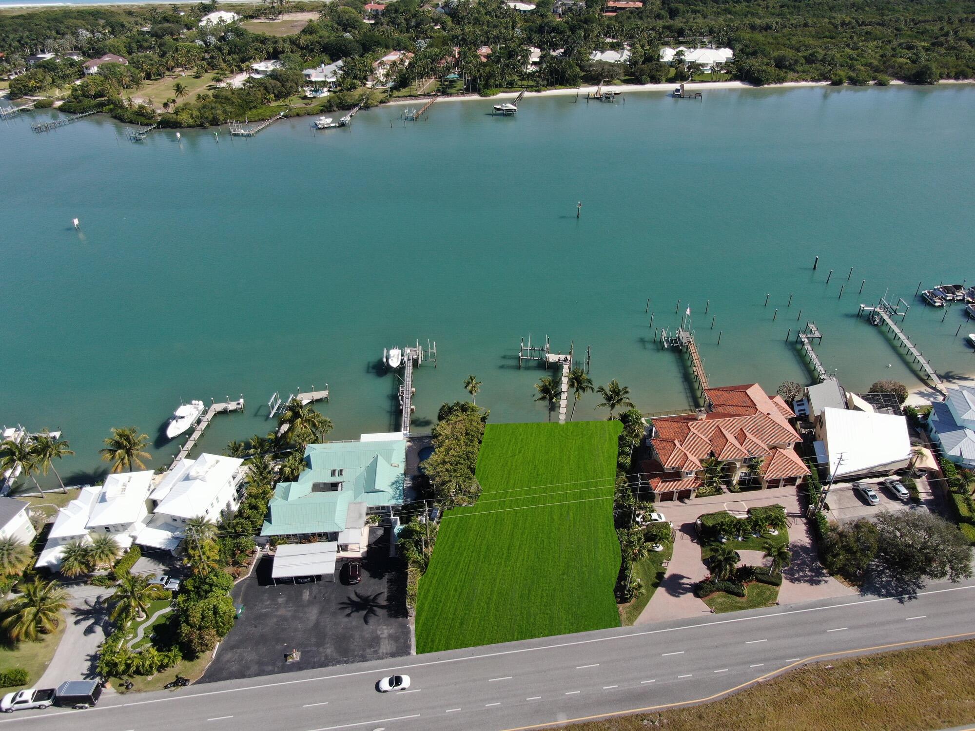 (ZONING: R3A, FUTURE LANDUSE: COM/OFF/RES)
If you are considering building in the Jupiter-Tequesta area on deep blue water within minutes to the Jupiter Inlet with beautiful views and no fixed bridges, this is a must see. The dock is new including composite decking and two boat lifts, one 60,000 lb. capacity and one 20,000 lb. capacity. The current house is considered a tear-down.