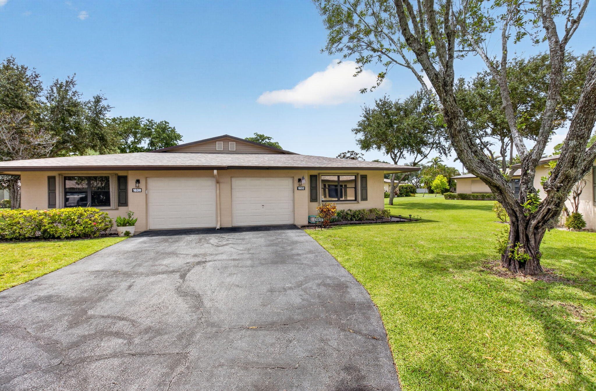 This charming 2 bedroom, 2 bathroom villa offers comfortable, low maintenance living in a prime location. Featuring tile floors throughout, a bright updated kitchen with white shaker cabinets and stainless steel appliances, and the convenience of an attached garage, this home blends modern style with everyday functionality. The split floorplan provides privacy, while the open living areas flow seamlessly to the outdoor patio, ideal for barbecuing, relaxing, or entertaining. A large driveway accommodates two cars, adding ease for guests or multi vehicle households. Residents enjoy access to fantastic community amenities, including two pools, a clubhouse, gym, and game room, creating a vibrant and active lifestyle right at home. Perfectly situated near shopping, medical offices, I 95, and local entertainment, this villa offers convenience, comfort, and a welcoming community atmosphere all just minutes from everything you need.