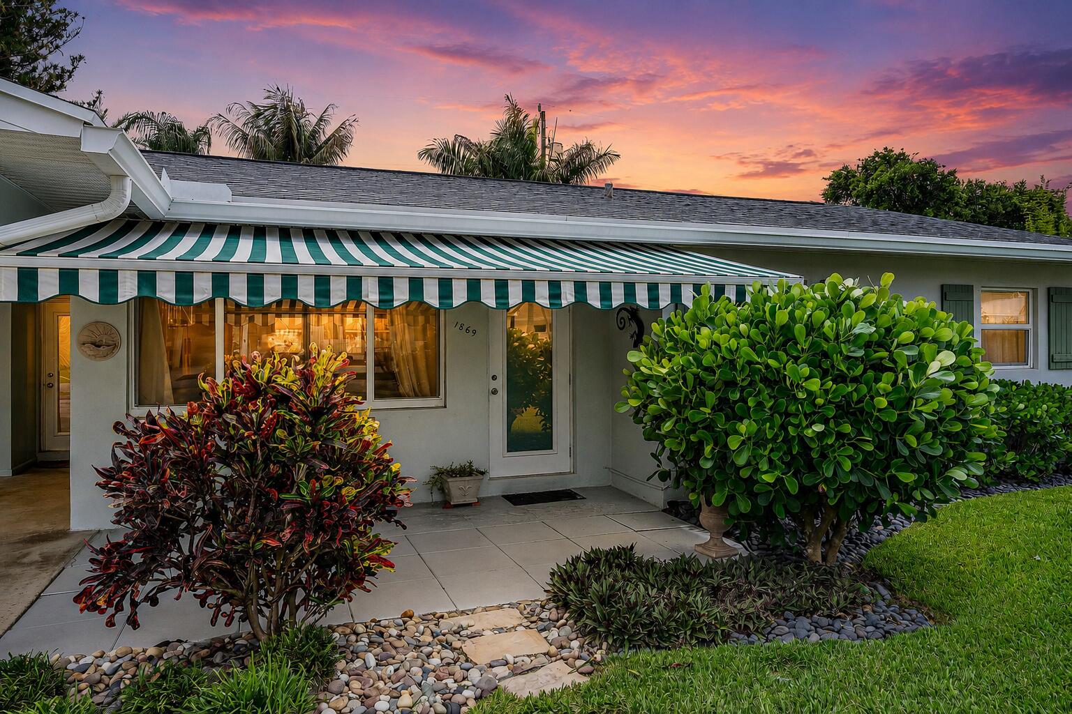WOW!  Get ready to be impressed.  This home is not only charming, but also impeccably maintained and upgraded.  A quaint 2 bedroom, 2 bathroom with air-conditioned sunroom featuring the most perfect wood ceiling.   The home includes a fully fenced private yard, an expansive shed, a large elevated patio and perfectly manicured lawn with zoned sprinkler system.   The owner has done an amazing job preparing the home for you by servicing the A/C, replacing all the duct work, revitalizing the whole home water filtration system, painting, cleaning and more.  You will not be disappointed!   The kitchen has been beautifully redesigned with white shaker cabinetry and stainless steel appliances.  The home welcomes you with an open floor plan and ample natural light.  Both front and back patios have a large extendable awning for enjoying your morning coffee or enjoying the beautiful Florida weather under the shaded cover.   Located in the HEART of North Palm Beach and the Juno Beach area. Walking distance to Juno Park with amenities galore such as baseball fields, basketball courts, a nature area, canoe / kayak access, boat ramp, picnic area, tennis court, playground and so much more! Immerse yourself in the outdoors and the great Florida lifestyle!     Pets are considered on a case by case basis, limit of 1.  Please note: no RVs, boats or trailers are permitted. Inquire today and let's make this beauty yours!