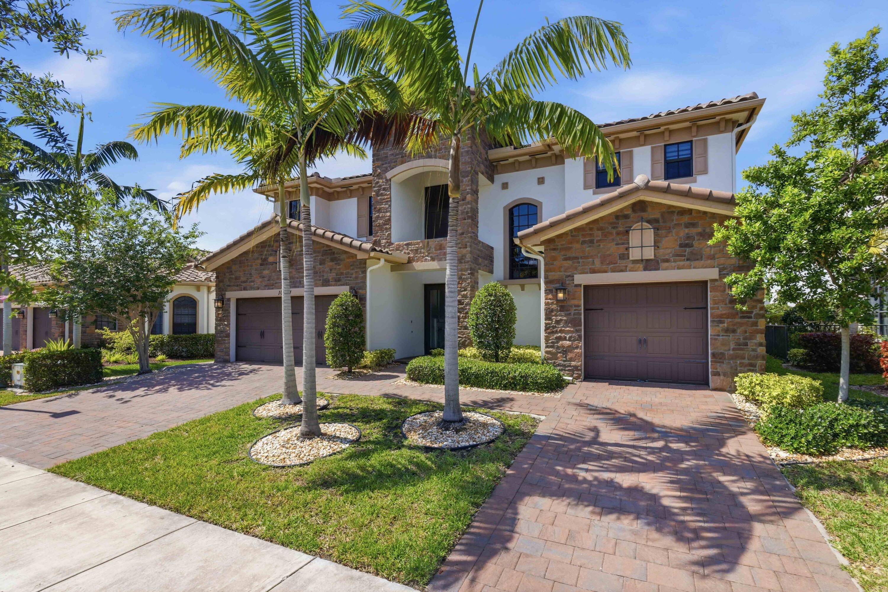 Experience Luxury waterfront living 2020 build of MiraLago. This exceptional lakefront estate offers 6 bed,  6.5 bath, spacious loft/game room, impact windows,  open-concept design with soaring ceilings, abundant natural light, and stunning lake views throughout. All guest bedrooms are en-suite.  The primary suite offers spa-inspired finishes, oversized custom closets, and serene water views. The chef-inspired gourmet kitchen includes premium appliances, an oversized island with seating, custom cabinetry, and Quartzite countertops, flowing seamlessly into the living and dinning area ideal for entertaining. Upstairs, the oversized loft provides versatile space for lounging or recreation. Outside, enjoy a private backyard oasis with a covered patio overlooking the lake, perfect for relaxing  and sunset views. Residents enjoy world-class amenities including clubhouse, pools, fitness center, and sports courts. A rare opportunity to own a sophisticated waterfront home in one of South Florida's finest communities. Pools, tennis, and fitness center at Club Miralago Clubhouse.