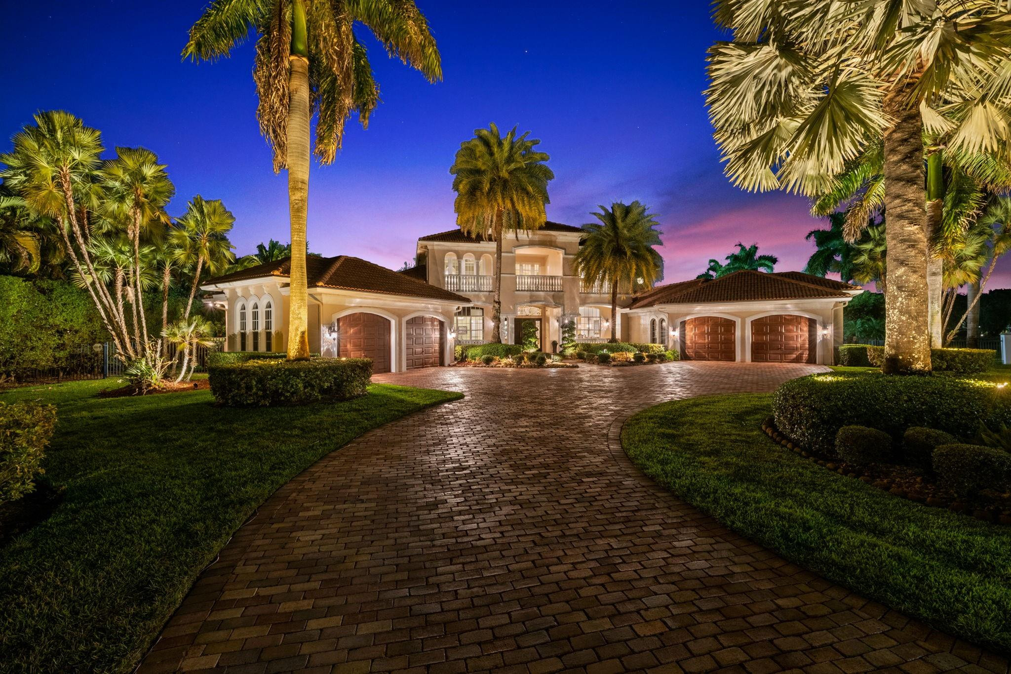 Stunning luxury estate with impact windows and doors, a first-floor primary suite, and private maid’s quarters with separate entrance. The spa-inspired primary bath features dual shower heads and a custom walk-in closet, while secondary bedrooms offer en-suite baths, including a junior suite ideal for guests. The chef’s kitchen includes a Sub-Zero refrigerator, Wolf gas range with double ovens, granite countertops, custom cabinetry, and a walk-in pantry. Coffered ceilings and a media room enhance the home’s appeal. Outdoors, enjoy tropical landscaping with lime, lemon, and orange trees surrounding a heated pool and cabana bath. Recent upgrades include newer A/C units, updated water heaters, and an in-ground Generac generator with a buried tank. A rare blend of luxury and comfort.