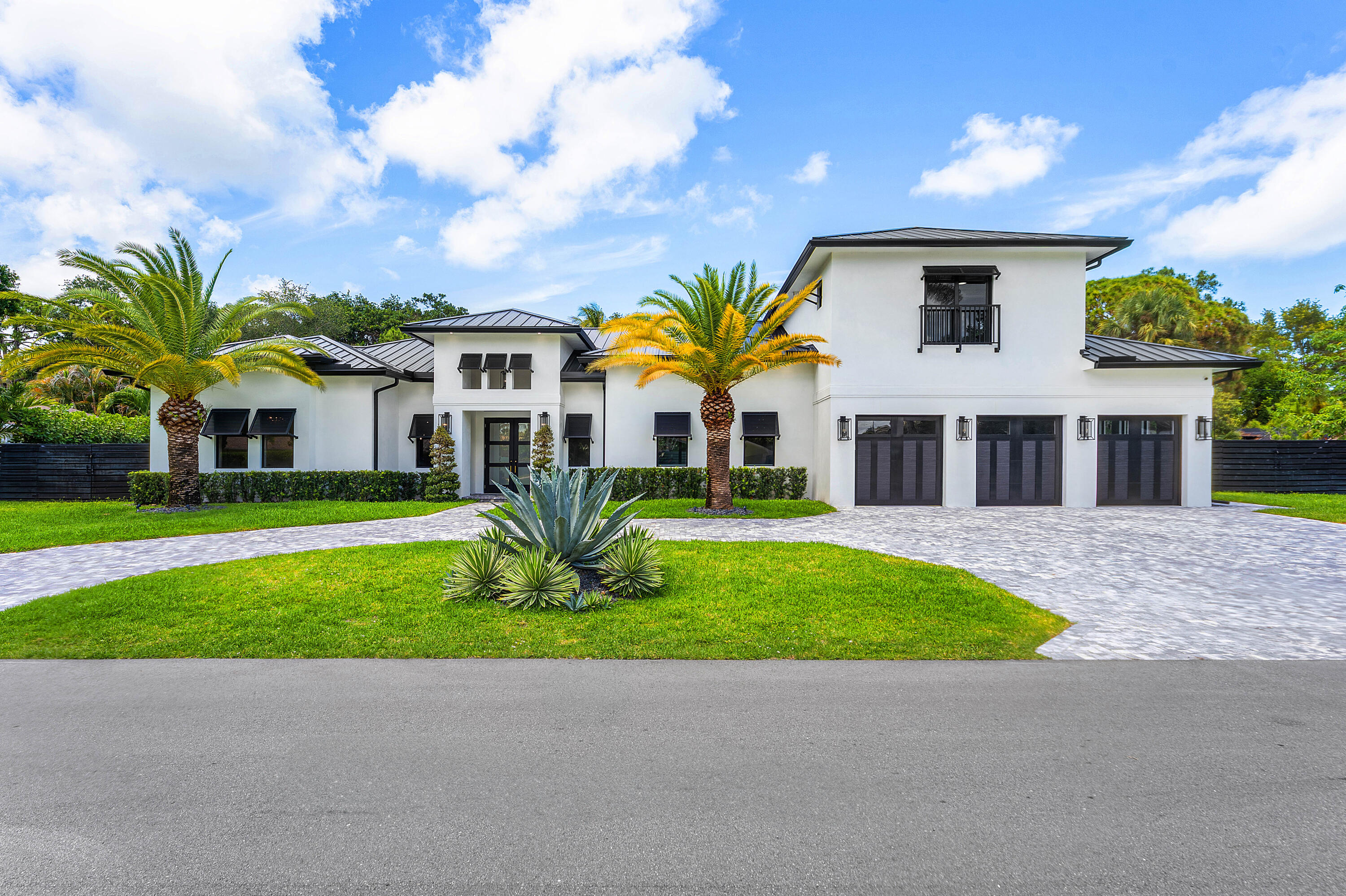 Welcome to this exceptional new construction home in one of Jupiter's most sought-after neighborhoods. Offering 5 BR/5.5 BA, a private guest casita, and a resort-style saltwater pool and spa. This home combines luxury, comfort, with the ultimate Florida lifestyle—And the freedom of no HOA fees.  Designed for effortless indoor-outdoor living, the light-filled open floor plan features impact glass, a metal roof, and exceptional  craftsmanship throughout. The chef's kitchen is a showpiece featuring Viking appliances, custom cabinetry, an oversized walk-in pantry, honed marble countertops, with dramatic waterfall island. Pocket doors open to a relaxing outdoor retreat complete with a covered lanai, summer kitchen, marble pool deck, saltwater pool, and spa. The first-floor primary suite offers  a private patio, dual custom closets, and a spa-inspired bath. Three additional bedrooms are situated in a separate wing, while the upstairs guest casita features a full kitchen, washer and dryer, and a Juliette balcony—ideal for guests, extended family, or a private office.   Additional highlights include a 3-car garage, spacious laundry room, and a versatile built-in workspace designed for studying, remote work or managing daily activities, and, to top it off, a custom under-stair dog retreat with a built in camera.    Just minutes from the Loxahatchee River, Jupiter's pristine beaches, championship golf courses, waterfront dining, and world-class shopping. With no HOA fees and ample room for a boat or RV, this exceptional residence offers the very best of Jupiter living, all within close proximity to Palm Beach International Airport and vibrant West Palm Beach.