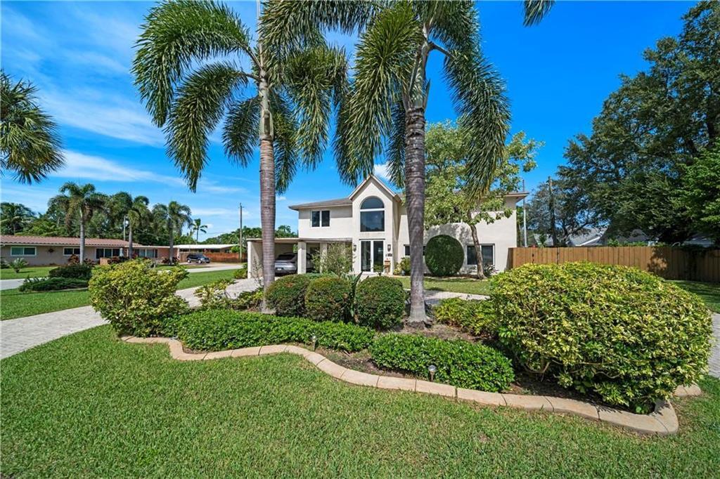 Rarely available updated 2-story 4 bedroom & 4 bathroom home in the heart of Wilton Manors offering warmth, comfort, and modern style. Light & bright open floor plan with hurricane impact windows & doors throughout. Welcoming foyer entrance flows into spacious living areas, formal dining, den, and updated kitchen with granite countertops, stainless steel appliances, custom cabinetry, and oversized breakfast bar. First floor primary suite with updated bath, walk-in shower, and custom closet. Upstairs oversized primary retreat with sitting area, spa-style bath, dual sinks, separate tub & shower, plus 2 additional bedrooms. Sliding glass doors open to private backyard with oversized patio, heated pool, jacuzzi, covered entertaining area, fenced yard, & beautiful new tile flooring throughout.