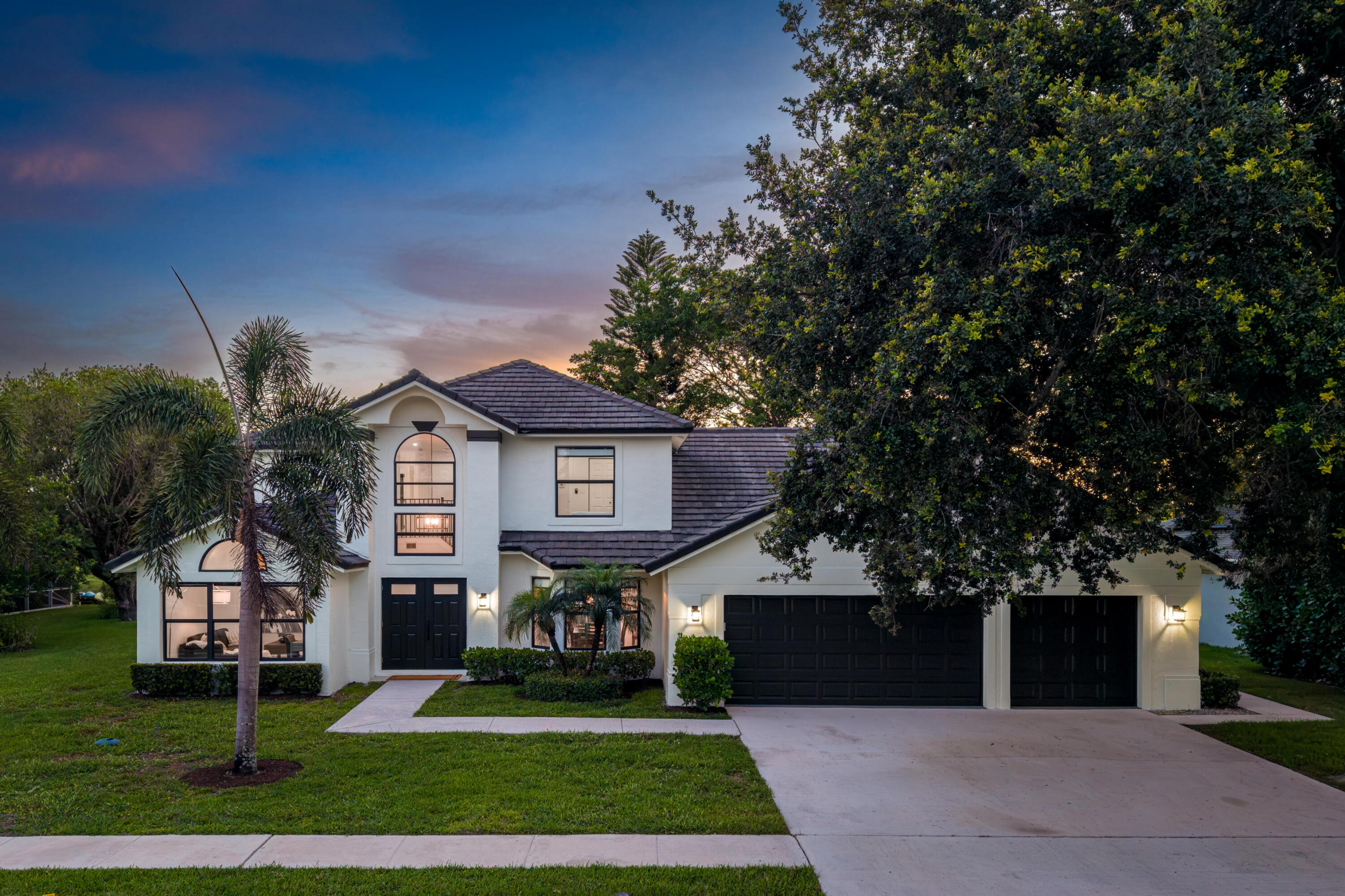 Welcome to this exceptional luxury pool estate in one of Wellington's most desirable locations. This spacious home features 5 bedrooms, a private office, a flexible multipurpose room, and 4 bathrooms with a functional layout designed for both everyday living and entertaining.  The first-floor primary suite provides privacy, a spacious bath, and walk-in closet. Open living spaces, soaring ceilings, and abundant natural light create an airy, upscale feel throughout the home.   Recent improvements include fresh exterior paint and major roof updates, adding peace of mind and long-term value.  The updated kitchen with an oversized island flows seamlessly into the main living and dining spaces. Step outside to a screened resort-style backyard featuring a heated pool, spa, cov ered lanai, outdoor dining, and peaceful water views. Offered fully furnished, this home provides a seamless move-in experience.  Additional highlights include an oversized 3-car garage, multiple flex spaces, no HOA, and a prime location minutes from Whole Foods, Publix, The Mall at Wellington Green, shopping, dining, top-rated schools, and major roadways.