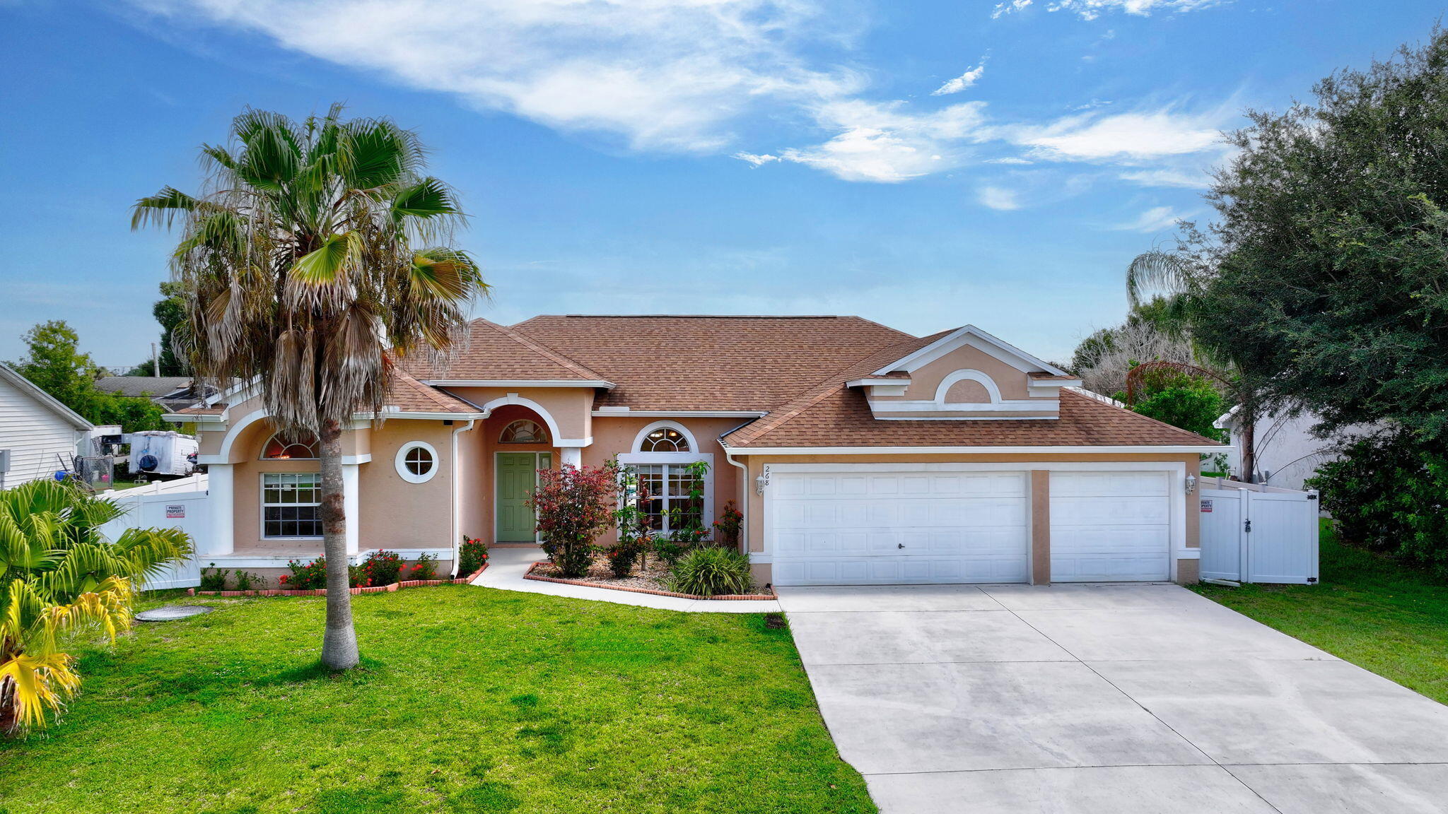 Where Comfort Meets Convenience for Either a Primary or Secondary Home! This move-in ready, spacious and comfortable home offers 4BR, 3BA, a 3-car garage, 2,349 SF of living area and 3,176 SF total, and was built in 2005 with CBS construction. Recent updates include a new roof (2022), new AC (2024), new fence (2023), and pool resurfacing (2024). Featuring a large kitchen with an island, a full set of Frigidaire stainless steel appliances, a breakfast nook overlooking the POOL, a spacious open floor plan and sliders to the lanai and pool patio, this home has been perfectly designed to create an incredible atmosphere for entertaining! Take a moment to explore everything the master bedroom and bathroom have to offer in the photo section. >> Click more for more information >> Working from home? No problem! You've got your own home office right off the kitchen. The 3 additional guest bedrooms and 2 bathrooms can easily accommodate your large family or a group of friends. Additionally, the 3-car garage and extended driveway offer space for your toys!    Enjoy the Florida lifestyle year-round with a heated pool!    Conveniently located near I-95, FL Tpke, and a public boat launch and PBI airport.   ALL WITHOUT THE HASSLE OF HOA RULES & FEES!!     Look for the complete list of features of this home under the document tab.