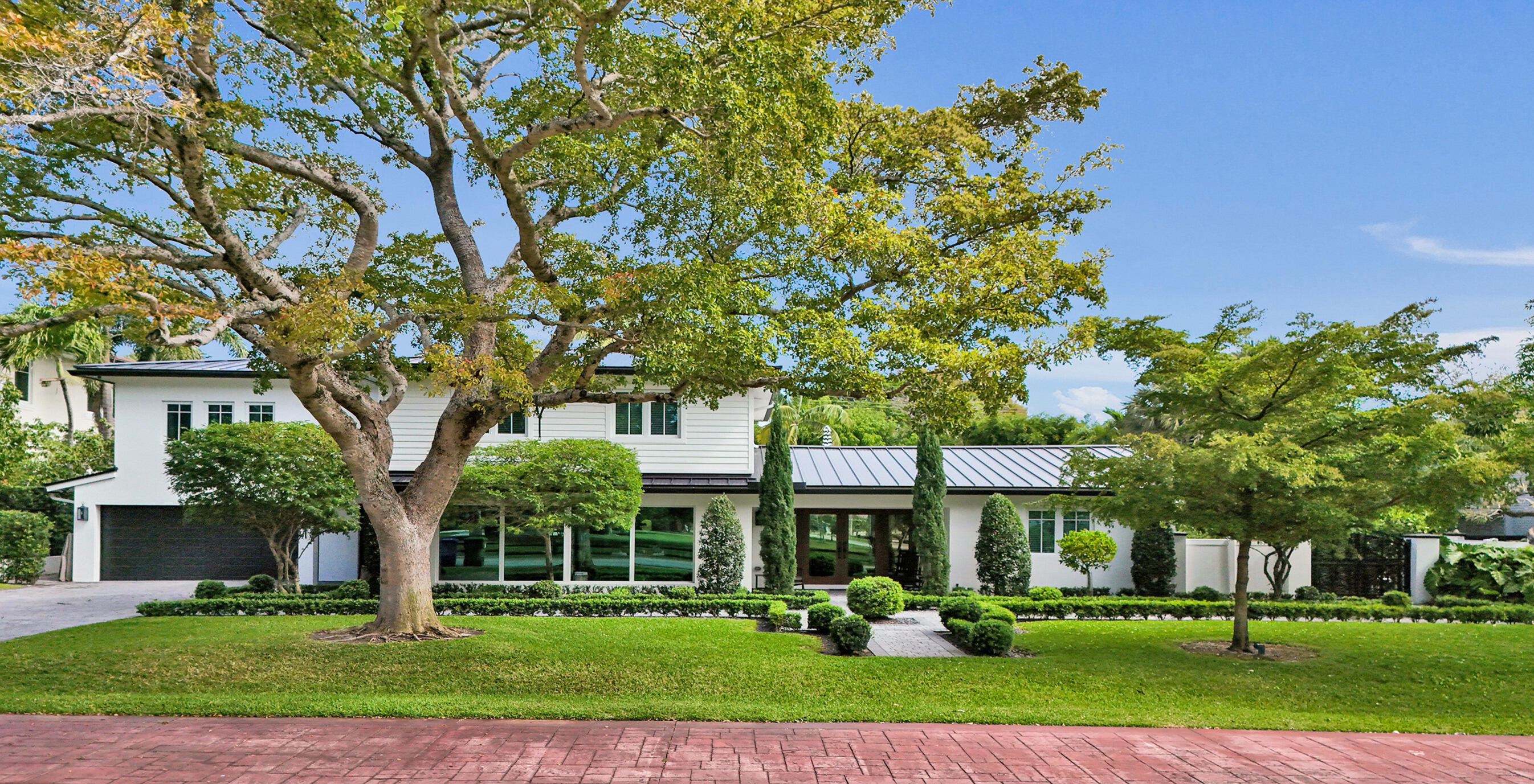 Magnificent estate, nestled on a 15k SF lot, across from George English Park. Fully renovated and designed in 2023 as a HOME, not another box. Featuring meticulous design and extreme attention to detail and luxurious touches. Designed with a luxurious, modern comfort motif, the home blends sleek architecture with enchanting design and inviting textures to create an elevated yet comfortable feel. Light-filled interiors unfold through expansive, open-concept living spaces, where dramatic ceiling heights, wide-plank flooring, and floor-to-ceiling glass transcend the average natural interior experience. Tranquil oasis retreat located in the backyard complete with summer kitchen, Tiki bar, pool, Jacuzzi and your own white-sand beach area.