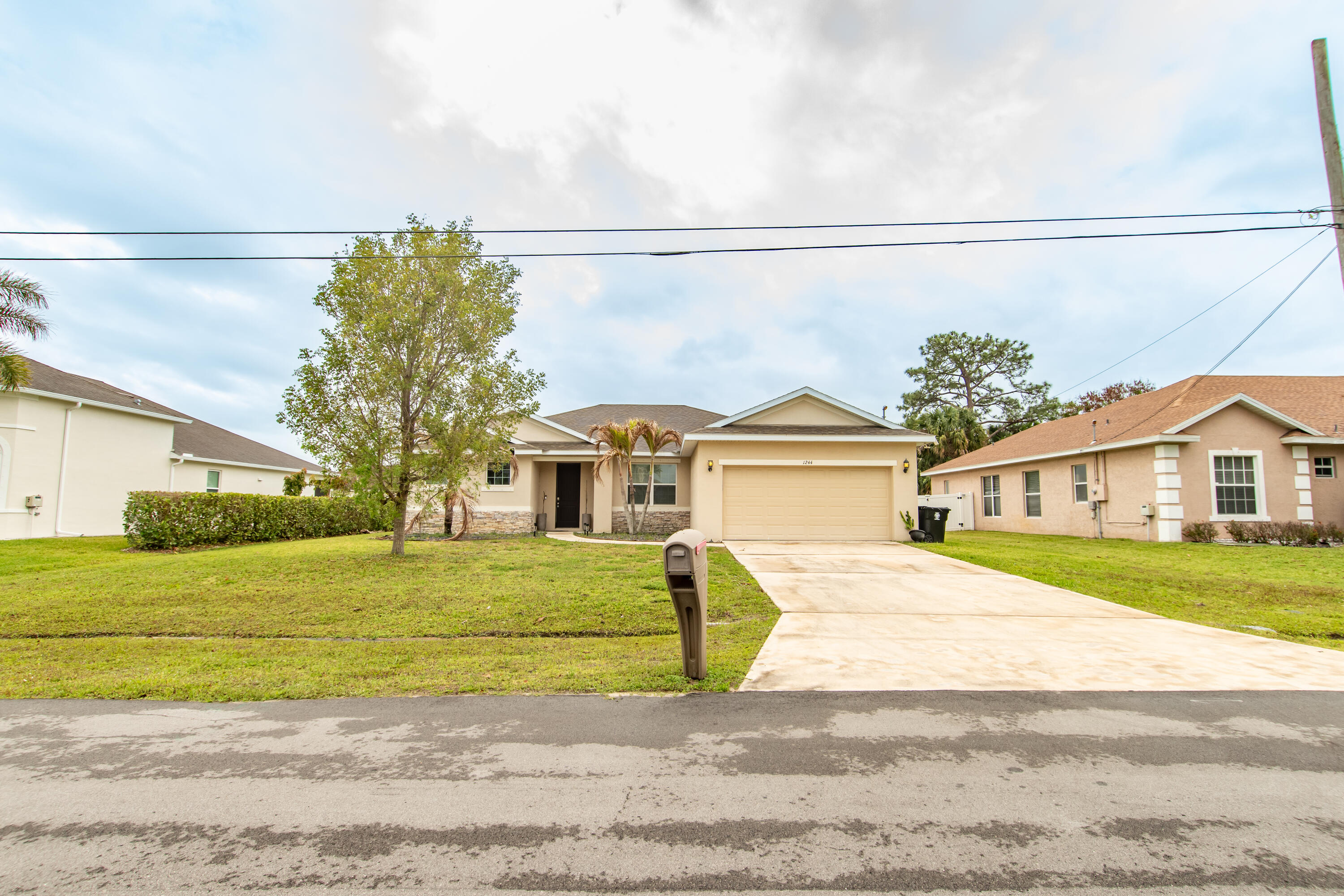 Welcome to this beautifully upgraded 3-bedroom, 2-bathroom home located in the heart of Port St. Lucie! This spacious residence features soaring high ceilings, 8-foot doors, and an open, airy layout designed for modern living.  The kitchen and bathrooms are finished with elegant granite countertops, complemented by 42" real wood cabinetry with crown molding, dovetail drawers, and soft-close doors offering both style and durability.   Enjoy generously sized bedrooms with walk-in closets, a 2-car garage, and a welcoming open porch perfect for relaxing or entertaining.  Conveniently located near shopping, dining, and major highways.