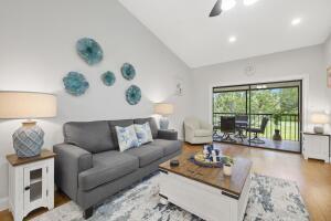 Welcome to this charming two-bedroom, two-bathroom condominium located in the attended, gated community of Windwood in Boca Raton, Florida. This 2nd story residence offers 920 square feet of finished living space, providing comfortable and efficient accommodations. The well-appointed layout features a full sized washer/dryer, updated kitchen, baths and wood laminate flooring. Situated within a 5 acre wildlife preserve.  Enjoy 2 pools, tennis, courts racquetball, basketball, clubhouse, dog park & walking trails. Pet-friendly (2 pets with a weight limit of 40 lbs each), rent immediately/Investor Friendly, 1 assigned parking space . Move-in ready!