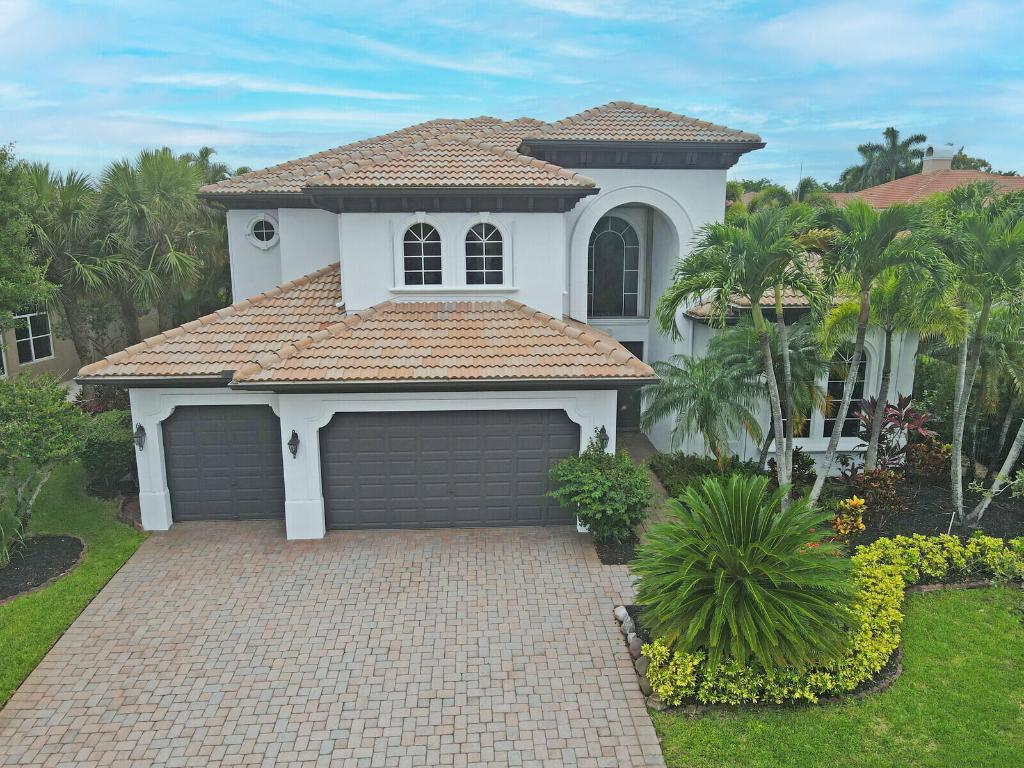 Don't miss this rare opportunity to own a stunning waterfront pool home in the desirable Wellington area. Nestled on a quiet street in the exclusive community of Wellington View, this elegant estate offers the perfect blend of space, privacy, & luxury.  Step through the grand double-door entry into a soaring two-story foyer, where floor-to-ceiling windows in the living room showcase breathtaking views of your own tropical oasis. Designed for both comfort & style, this beautifully maintained home features a freshly painted exterior (2025), ACCORDION HURRICANE SHUTTERS, a newer whole-house water softener (2022), and a newer pool heater (2022).  Additional highlights include tray ceilings, crown molding, diagonally laid tile, a striking wood staircase, and ample recessed lighting that ... fills the home with natural warmth and brightness.  The oversized ground-floor owner's suite is a true retreat, offering a cozy sitting area, dual walk-in closets with custom built-ins, and direct access to the pool and patio. Unwind at the end of the day while enjoying serene waterfront views in complete privacy.

Wellington View offers a 24-hour manned gate for security, beautifully maintained surroundings, and low HOA fees that include basic cable and monthly alarm monitoring. Its central location in Palm Beach County places you within a short drive of CityPlace, Palm Beach International Airport, Palm Beach Gardens, Boca Raton, and Delray Beachmaking this one of the most desirable addresses in the area.