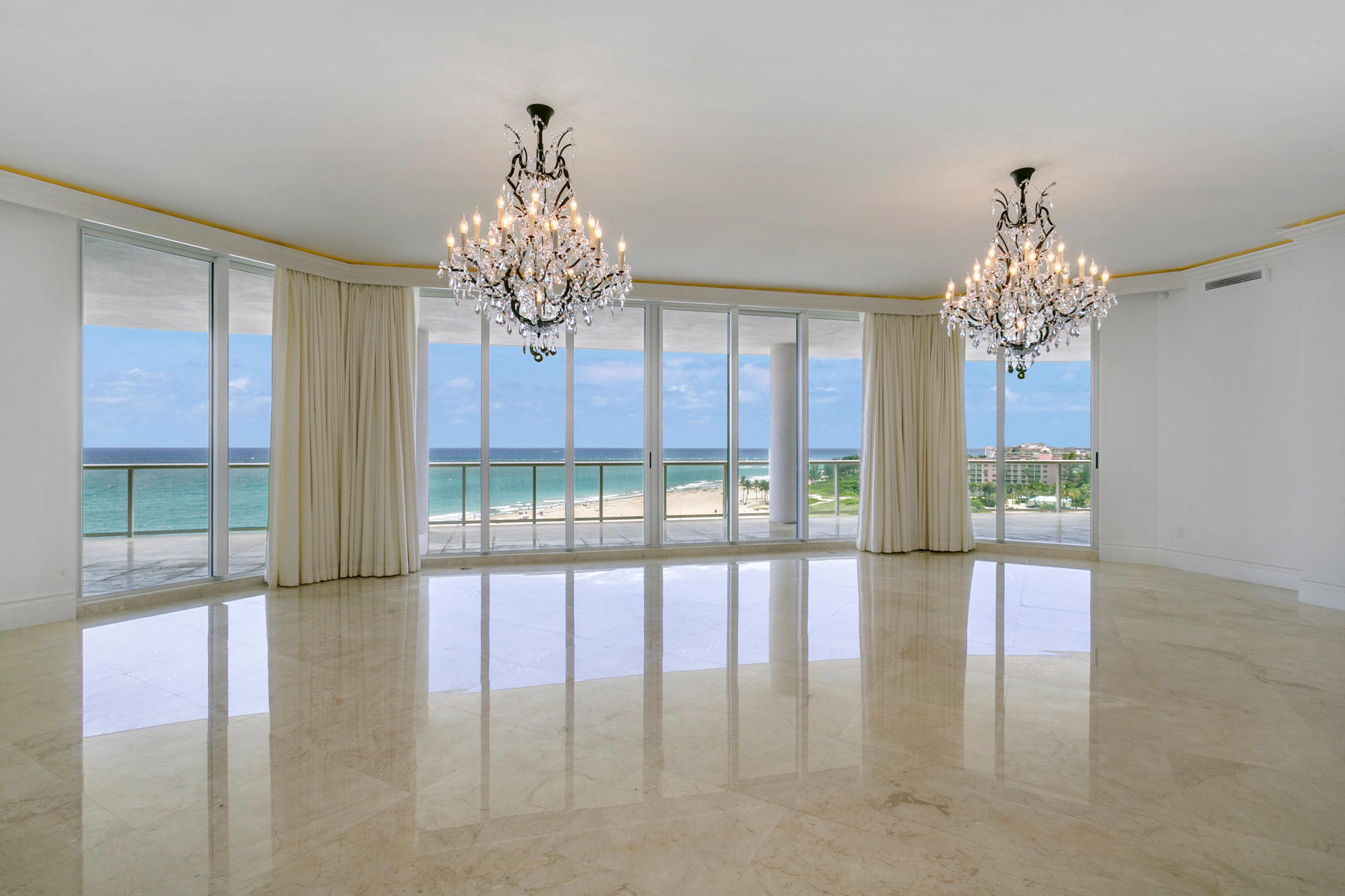 One of the largest condominiums in South Florida! Experience the ultimate lifestyle. The perfect blend of comfort, style and function. Over 7,440 SF of interior space. Multiple living areas with 9,179 total SF!!  A substantial home office overlooking the ocean – no commuting! The great room spans 33'' X 33'' and includes a kitchenette area with bar, wine cooler, refrigerator, ice maker and dishwasher. Perfect for family gatherings. The kitchen includes top of the line appliances,....click on see more  separate catering room. The dining room is suited for a crowd with additional eating area off the kitchen. The master suite is an oasis of relaxed spaces from the his and her bathing areas, separate walk in dressing rooms, a spacious ''getaway'' space for morning coffee or late-night chats The Ritz Carlton services are complemented with 24 hr. security, concierge, valet, private restaurant with pool service.  Conference room, library, media room and state of the art fitness center.  A private beach area awaits you with complementary seating....it's all here.  Come and enjoy the lifestyle.