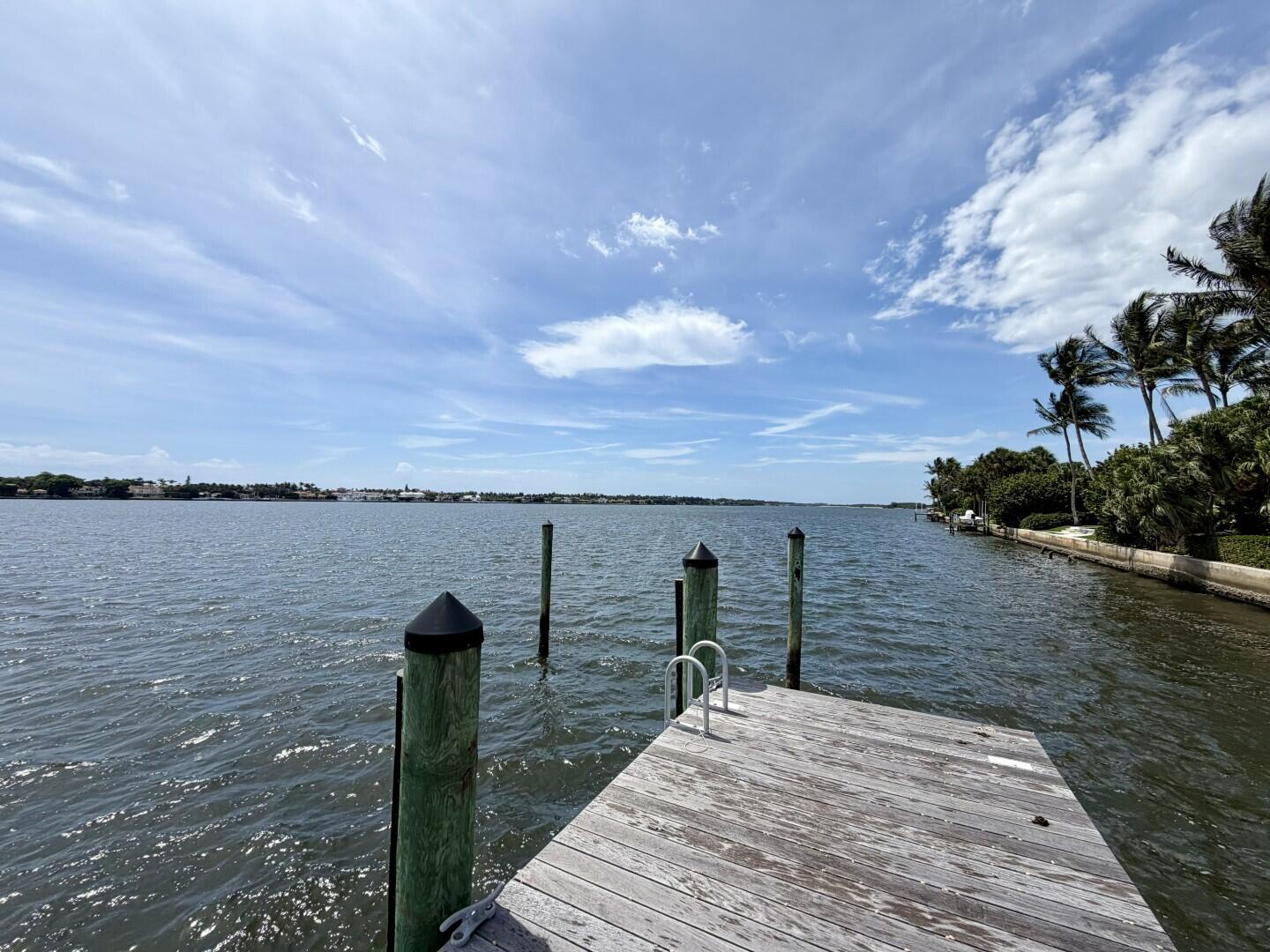 Remarkable and rare opportunity! This exceptional lakefront property is situated on an oversized, east-facing lot on the coveted Everglades Island, offering approximately 175 +/- feet of direct Intracoastal frontage, a private boat dock with lift, and spectacular wide water views. An extraordinary opportunity to build a custom waterfront dream home in one of Palm Beach's most desirable locations.