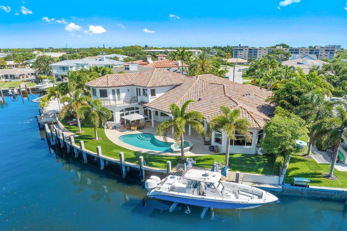 Boca Raton, FL WATERFRONT Estate in LAKE ROGERS with 120ft. Protected Dockage with 150 ft. turning basin only 350 ft. from the Intracoastal waterway with no fixed bridges. NEW elevated concrete boat dock, NEW enlarged turf grass back yard, 20k lb. Neptune Boat Lift in 2023.

Meticulous custom-built PRIVATE home by Cudmore Builders on a quiet cul-de-sac with 5 bedrooms, 5-1/2 baths, 3+ car garage (room for car lift), chef's kitchen, plus outdoor kitchen, natural gas cooktop, travertine floors, high volume 13 ft. ceilings, hurricane windows & doors, whole house GENERATOR.

1st Floor Master bedroom VIP Suite with his & her walk-in closets & master bath. 2nd bedroom, office/3rd bedroom with full baths, Laundry room all on 1st floor. 2nd floor suite with 4th & 5th bedrooms w/en-suite baths