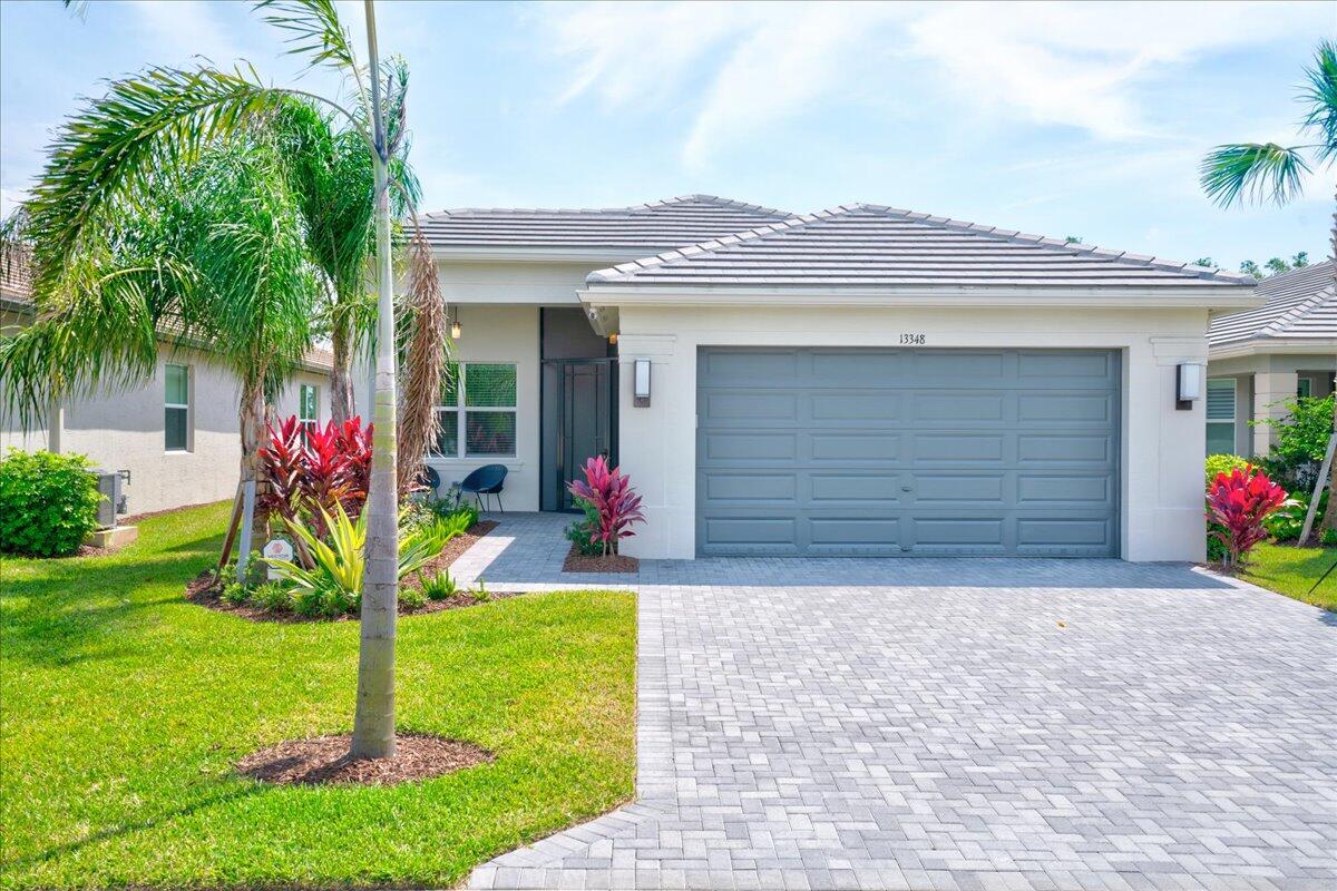FOR SALE - Welcome to this beautifully upgraded Sierra model in GL Homes' highly sought-after 55+ community of Valencia Grove at Riverland in Port St. Lucie. Offering 3 bedrooms, 2 bathrooms, and 2,064 square feet under air, this thoughtfully designed residence blends comfort, functionality, and a light coastal aesthetic. Inside, the open-concept floor plan is enhanced by added high-hat lighting and ceiling fans throughout, creating a bright and inviting living space ideal for both everyday living and entertaining. The chef-inspired kitchen features upgraded Level 4 soft beige cabinetry, a spacious center island with additional storage, and a vented microwave—perfectly positioned to anchor the heart of the home.  . The flexible third bedroom, currently configured as a den, offers added privacy with stylish pocket doors, making it ideal for a home office, media room, or guest space. The interior has been freshly painted, further enhancing the home's clean, move-in-ready appeal. Select furnishings are negotiable, offering an easy, turnkey opportunity for buyers. Additional upgrades include a laundry room with a utility sink, an upgraded security system, an epoxy-coated garage floor, a screened front porch, and a widened paver driveway and walkway all of which elevate the home's curb appeal. Perfectly positioned just moments from the scenic Riverland Paseo, residents enjoy convenient access to the Sports & Racquet Club, Arts & Culture Center, and Social Hall. Beyond the gates, you're minutes from Cleveland Clinic, premier shopping and dining, and spring training with the New York Mets at Clover Park. Enjoy resort-style living with world-class amenities including a full-service clubhouse, restaurant and outdoor bar, multiple resort and lap pools, a state-of-the-art fitness center, arts and culture studios, and over 40 tennis and pickleball courts. Don't miss this opportunity to own a beautifully upgraded Sierra in one of Port St. Lucie's premier 55+ communities.