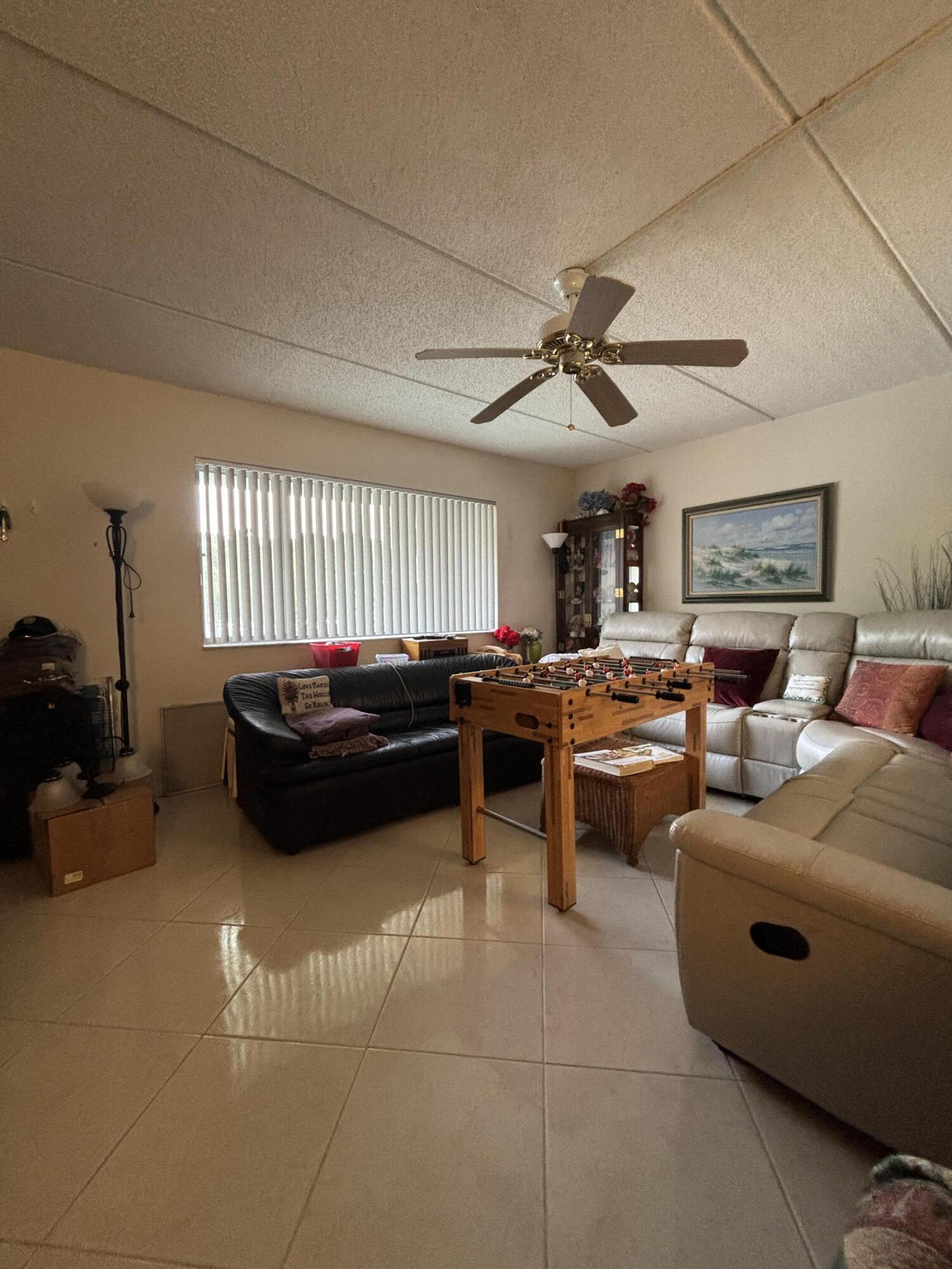 Enjoy easy South Florida living in the desirable 55+ community of Regal Palms in Palm Springs, conveniently located just minutes from Interstate 95, Palm Beach International Airport, shopping, dining, and downtown West Palm Beach. This well maintained second floor condo in the Eaton Building offers a spacious 1 bedroom, 1.5 bathroom floor plan with ceramic tile throughout, an open living and dining area, and a generously sized primary suite with a private bath. Relax on the enclosed screened patio overlooking the beautifully landscaped courtyard, the perfect place to enjoy your morning coffee or unwind at the end of the day. A wonderful opportunity to enjoy comfort, convenience, and an unbeatable location.