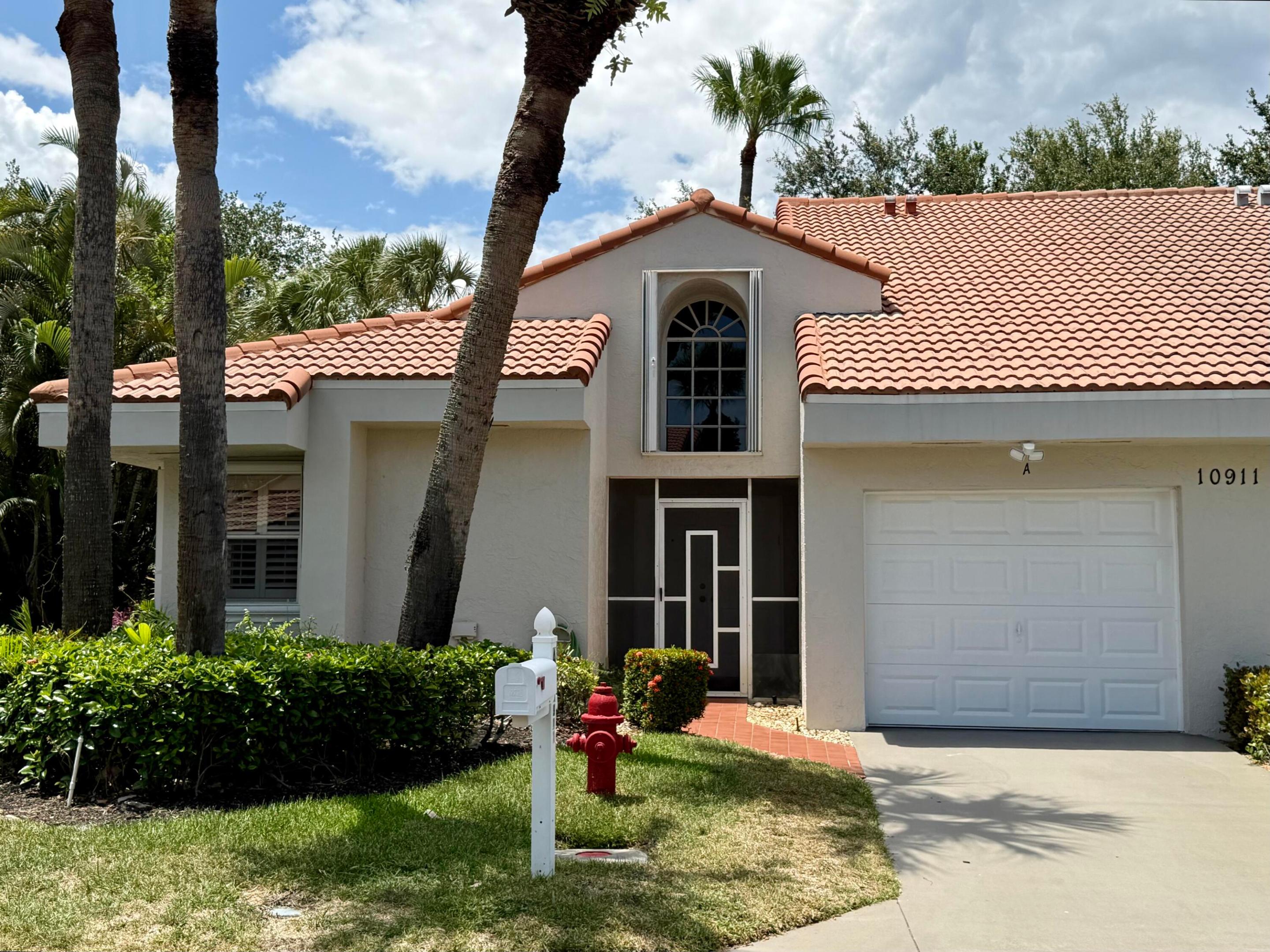 BEAUTIFUL CORNER VILLA WITH GARAGE AND PRIVATE GARDEN VIEWS. LARGEST MODEL. This light-filled home features a spacious open floor plan with plantation shutters throughout. The updated kitchen offers granite countertops, stainless steel appliances, plus a breakfast area. Enjoy generous living space including a large living room, dining area, family room, & laundry room. Relax year-round in the air-conditioned Florida room with sliding glass doors overlooking a private garden view. The primary suite features a walk-in closet and renovated bath with dual vanities and walk-in shower. A split-bedroom layout provides privacy for guests with a 2nd bedroom & renovated 2nd bath. Equipped with accordion storm shutters. Located in a gated 55+ community offering a clubhouse,  *see supplement remarks* Located in a gated 55+ community offering a clubhouse, resort-style pool, tennis and pickleball courts, fitness center, and scenic walking paths. Lawn care is included in the low HOA fee. Emotional Support Animals and Service Animals are welcome.  Active Boca Raton area with lots of shopping, dining, and recreation. Quick closing ok.  Exterior painting-2025.  Roof- 2008.  Accordion Shutters- 2014.  Air Conditioner-2024.  All kitchen appliances- 2023.