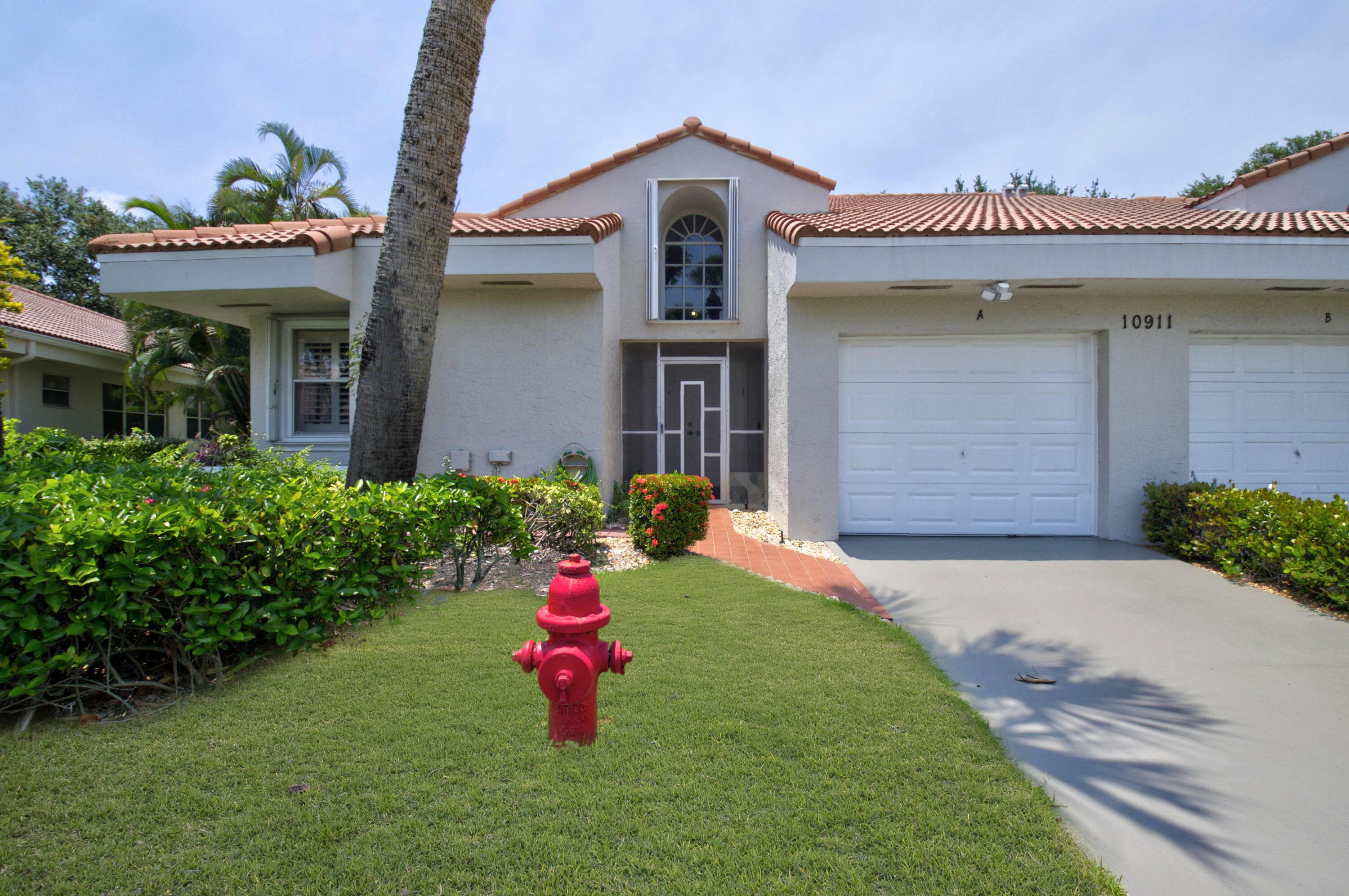 BEAUTIFUL CORNER VILLA WITH GARAGE AND PRIVATE GARDEN VIEWS. LARGEST MODEL. This light-filled home features a spacious open floor plan with plantation shutters throughout. The updated kitchen offers granite countertops, stainless steel appliances, plus a breakfast area. Enjoy generous living space including a large living room, dining area, family room, & laundry room. Relax year-round in the air-conditioned Florida room with sliding glass doors overlooking a private garden view. The primary suite features a walk-in closet and renovated bath with dual vanities and walk-in shower. A split-bedroom layout provides privacy for guests with a 2nd bedroom & renovated 2nd bath. Equipped with accordion storm shutters. Located in a gated 55+ community offering a clubhouse,  *see supplement remarks* Located in a gated 55+ community offering a clubhouse, resort-style pool, tennis and pickleball courts, fitness center, and scenic walking paths. Lawn care is included in the low HOA fee. Emotional Support Animals and Service Animals are welcome.  Active Boca Raton area with lots of shopping, dining, and recreation. Quick closing ok.  Exterior painting-2025.  Roof- 2008.  Accordion Shutters- 2014.  Air Conditioner-2024.  All kitchen appliances- 2023.