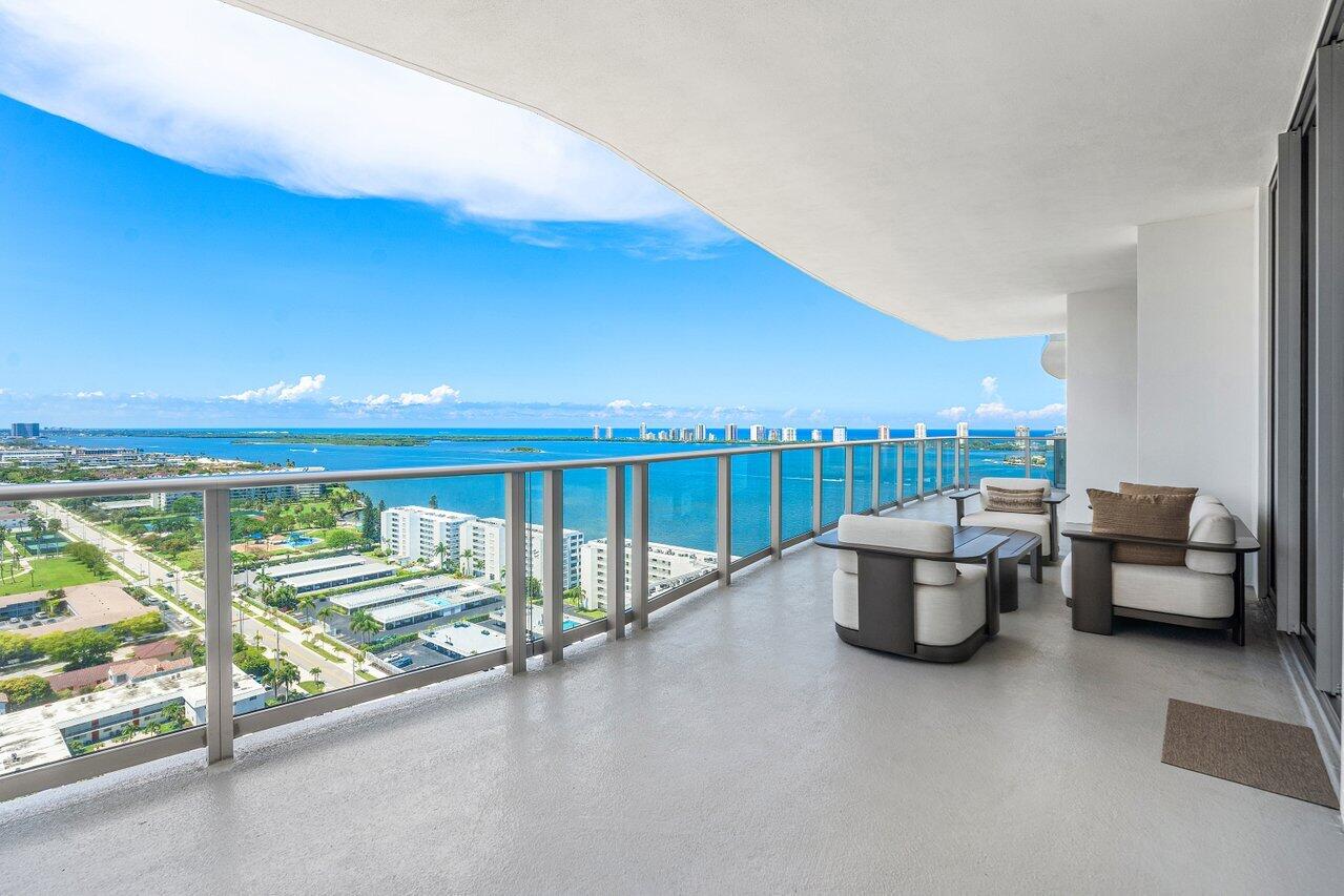 Positioned high above the intracoastal with sweeping, unobstructed views stretching across Singer Island, North Palm Beach, and the Atlantic Ocean, SkySuite 2109 at Nautilus 220 represents a rare opportunity to secure one of the building's premier high-floor residences. This expansive three-bedroom plus den, three-bathroom residence with an additional powder room was designed for elevated waterfront living, combining exceptional scale with refined contemporary finishes and soaring 10-foot ceilings throughout. Floor-to-ceiling glass frames dramatic water and skyline views from nearly every room, while the oversized private terrace invites seamless indoor-outdoor living from sunrise through evening. SkySuite 2109 is among the most desirable offerings within Nautilus 220 — a premium, rarely available high-floor residence delivering both privacy and presence within one of Palm Beach County's newest luxury waterfront addresses. Available for immediate occupancy, this is an opportunity to move directly into brand-new construction without the wait.  Residents enjoy a fully serviced, resort-driven lifestyle with top-tier concierge services, valet, marina access, security, multiple pools, and a curated amenity experience designed to rival the finest private resorts.  High-floor SkySuites of this caliber rarely become available. Experience the scale, views, and lifestyle firsthand — schedule your private tour of SkySuite 2109 today.