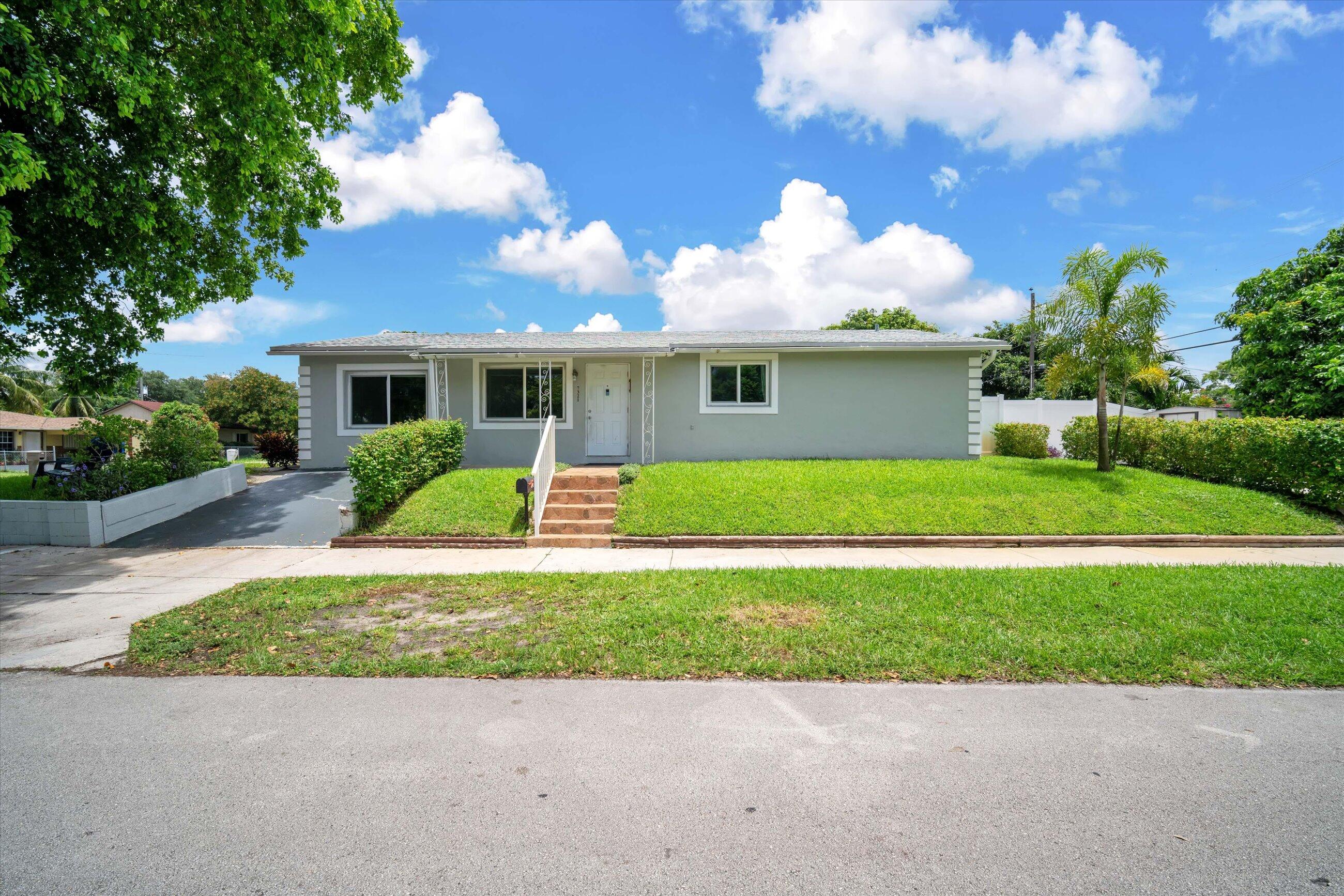 Spacious 5-bedroom, 4-bathroom home situated on a desirable corner lot in sought-after Driftwood Estates! This versatile property features a remodeled kitchen, impact windows, and a roof installed in 2019. The private fifth bedroom includes an en-suite bathroom and separate exterior entrance, offering excellent potential for guests, multigenerational living, or future rental income. Enjoy an upgraded sprinkler system connected to a private well. Conveniently located near the Florida Turnpike, I-95, shopping, dining, entertainment, and Hollywood Beach. Schedule a showing today!