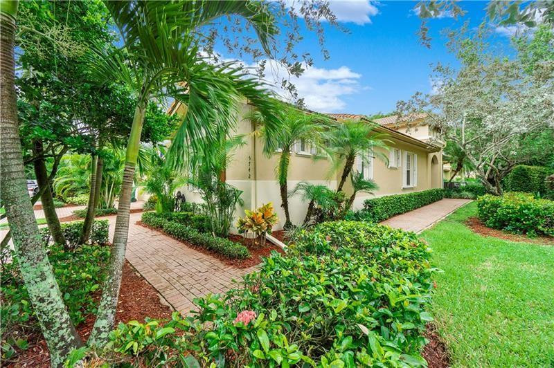 Updated one-story corner home with a one-car garage on a landscaped interior lot with open garden views, private fencing, and an expanded patio, perfect for outdoor living. This home features crown molding and baseboards, with laminate wood flooring in living areas and bedrooms. The remodeled primary bathroom offers double vanities, a frameless glass shower with dual shower heads, and Kohler fixtures. The updated kitchen includes granite countertops, tumbled marble backsplash, LG stainless steel appliances, and a breakfast bar. Additional features include accordion shutters, pull-down attic stairs in the garage with storage, and an oversized driveway for 2+ vehicles. Enjoy a short walk to the heated community pool and hot tub, with access to Heron Bay amenities and A+schools. Tenant occupied, lease ends October 14/2026.